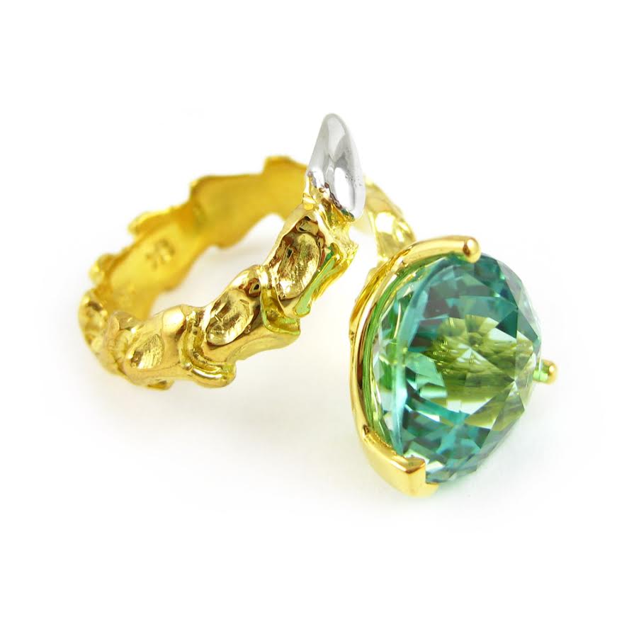   Small Vertebrae ring in 18k yellow gold with white gold tail and 8.79 carat neon green tourmaline,&nbsp;$37,825.  