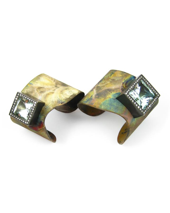 Left: K Brunini Body Armor cuff in sterling silver with a 18.99 carat french cut green beryl and gray diamonds, $13,850. Right: Body Armor cuff in sterling silver with a 32.35 carat french cut green beryl and gray diamonds, $18,475.