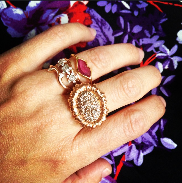  Mish's sunflower ring (middle finger) pairs perfectly with her own mix-and-match bridal stack, including a Marie Helene de Taillac lips ring.&nbsp; 