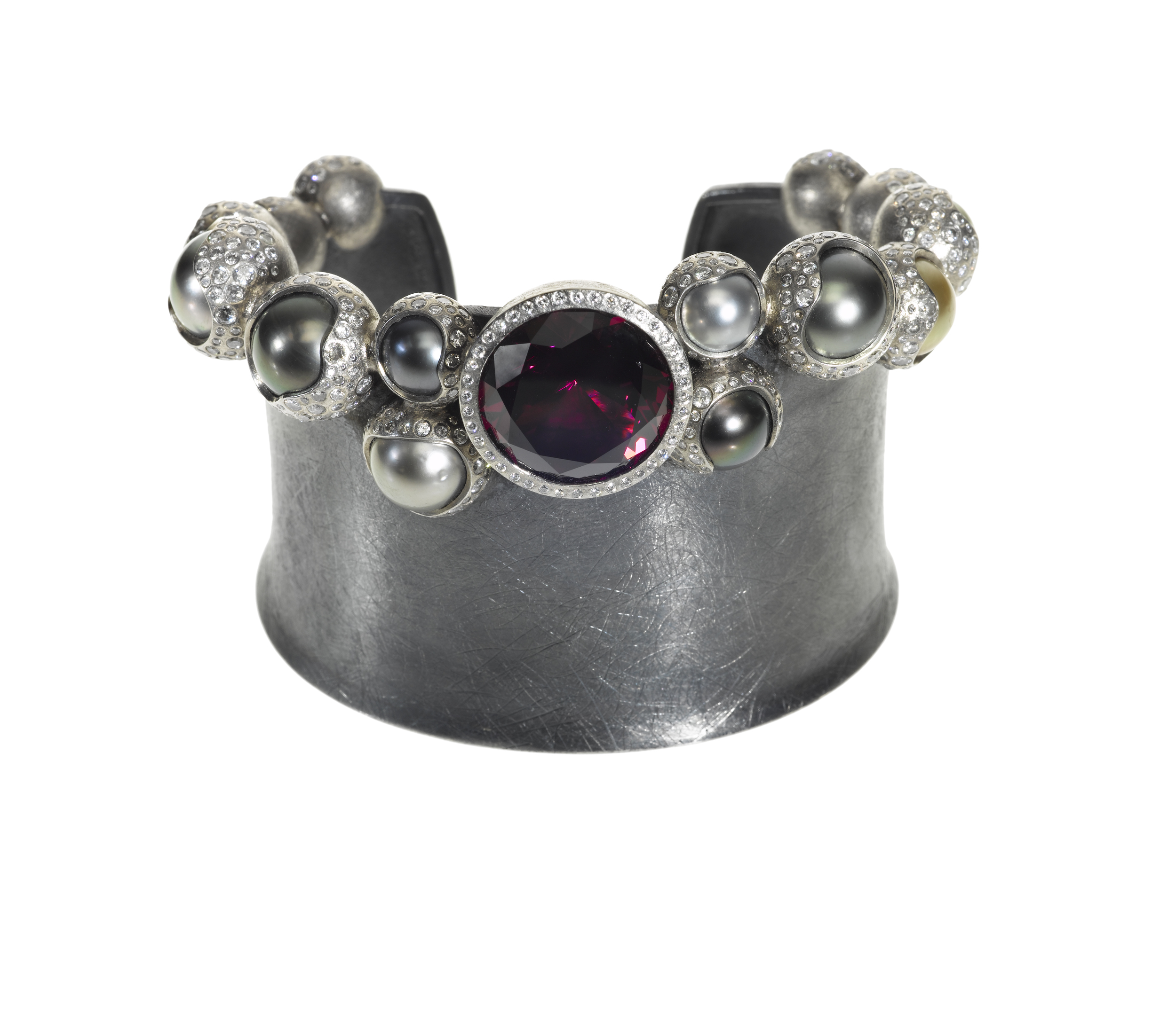   This&nbsp;pearl and garnet cuff&nbsp;in Palladium, silver, garnet (24.97 ctw), white brilliants (9.528 ctw), and Tahitian pearls, $158,400,  available at Todd Reed .&nbsp;  