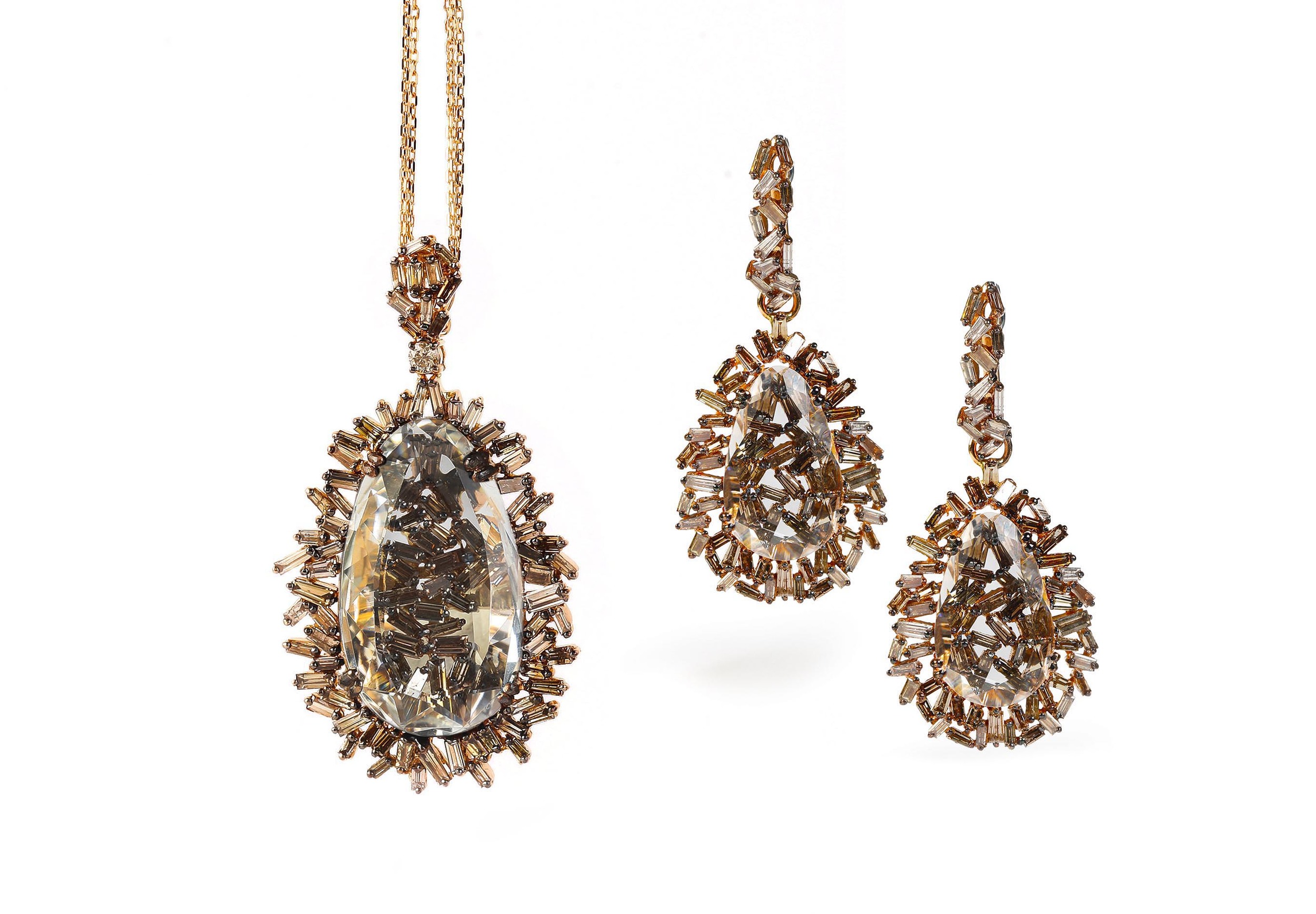  18k gold earrings and matching necklace from the Vitrine Fireworks collection.&nbsp; 