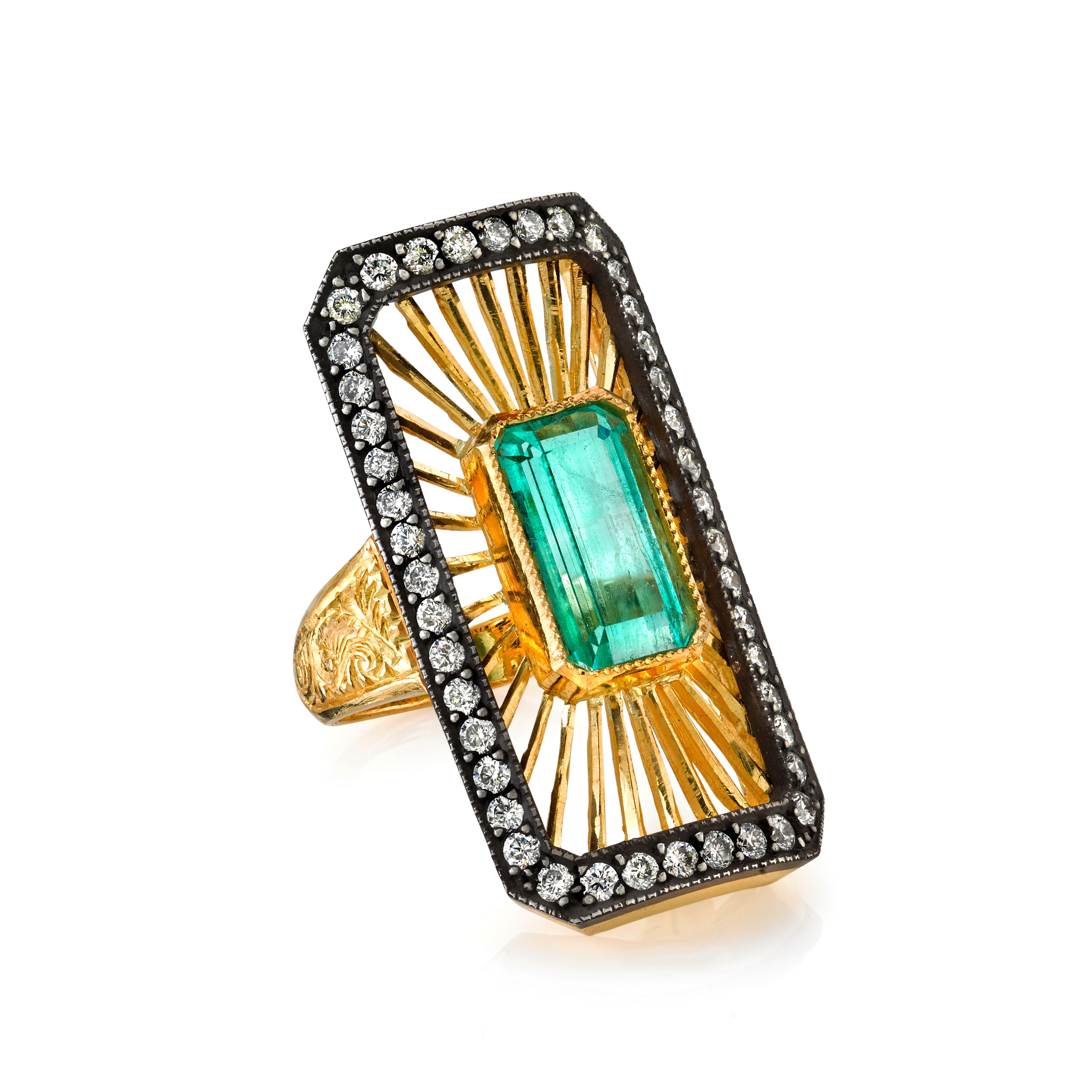  22K gold and silver Deco ring with an emerald center and diamonds, $14,560.&nbsp; 