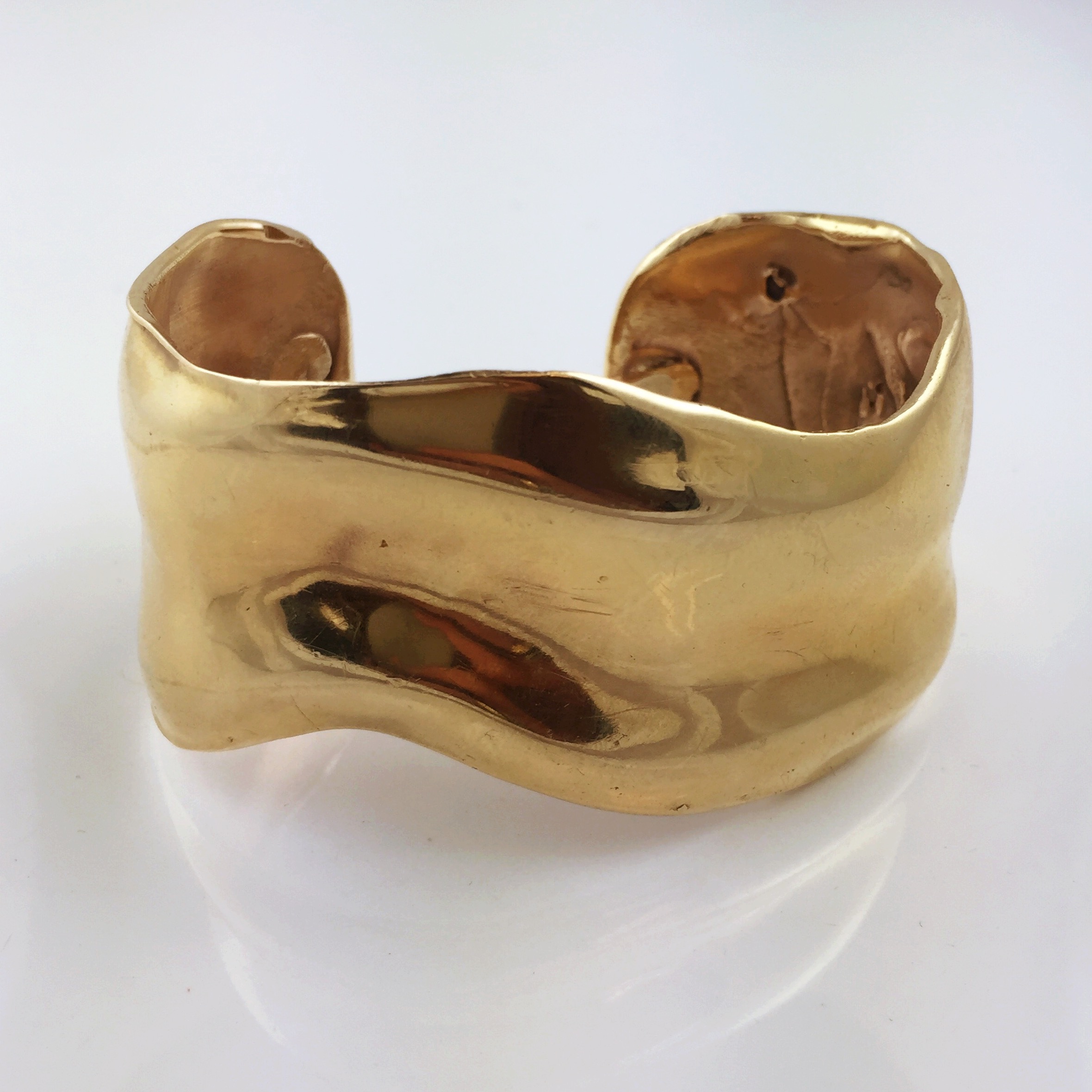  The gold cuff bracelet he made for his mother, and then gifted to his daughter on her 25th birthday.&nbsp; 