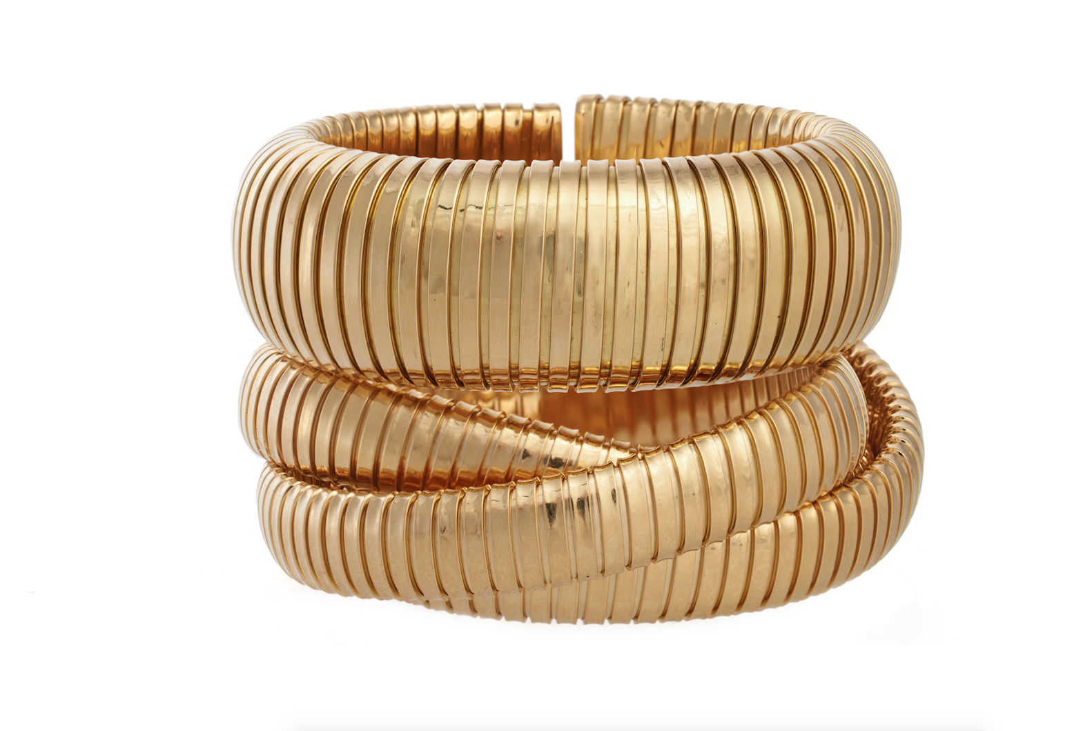 Domed cuff and rolling bracelet in 18k yellow gold. 