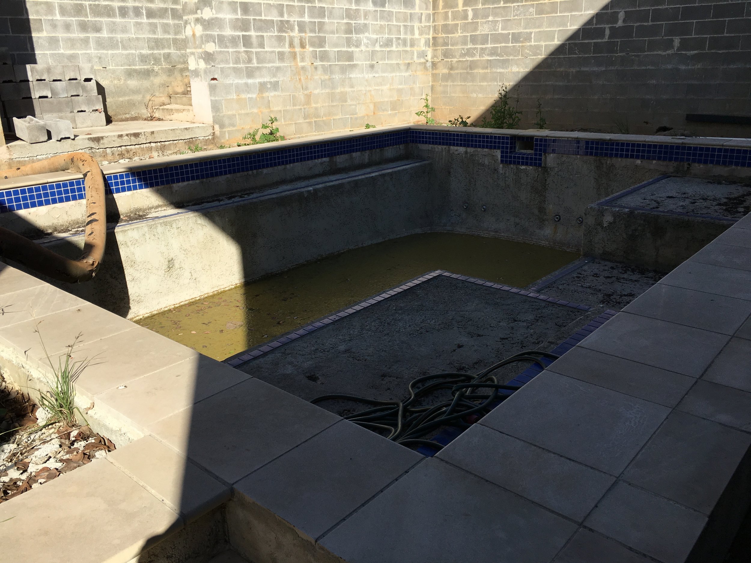 Before - a slimy grey mess of concrete and clockwork.