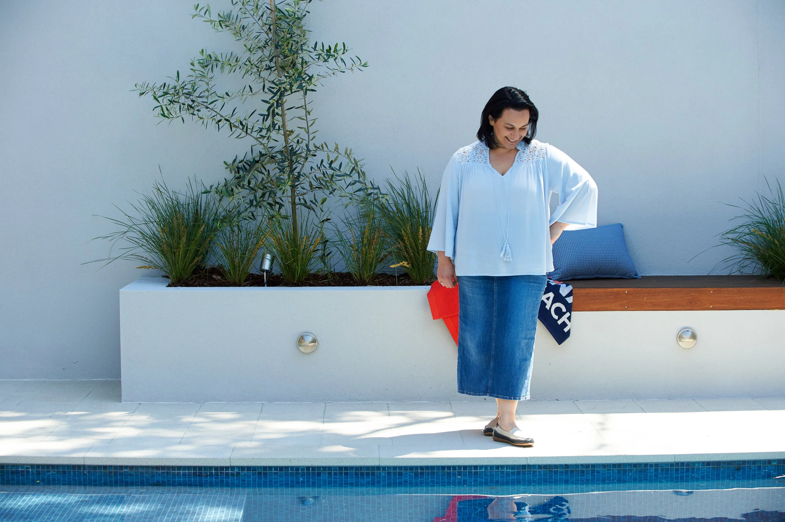 Our lovely client enjoys her new life poolside.
