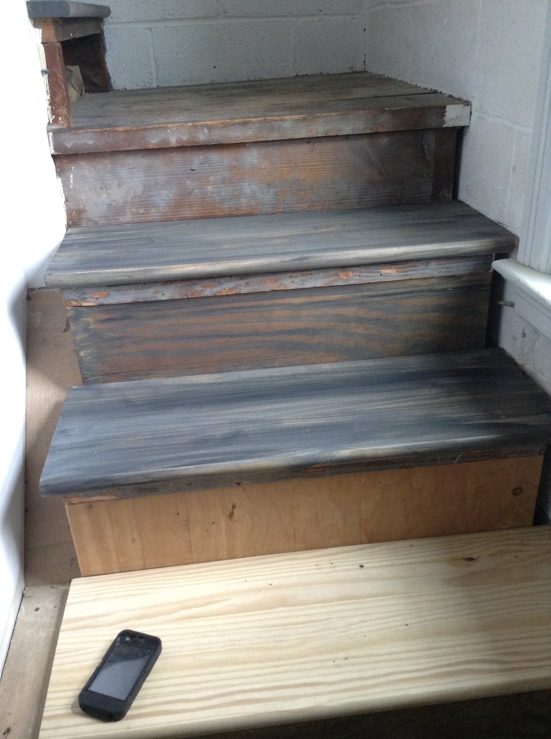 our new pine treads were aged with a gray wash to better match the existing wood that we reused 