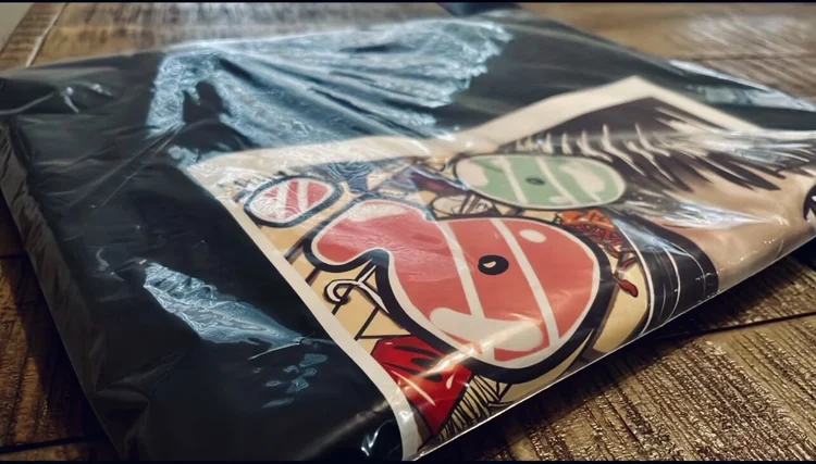 Only Tru Luv Procrastination Tee packaged on wood