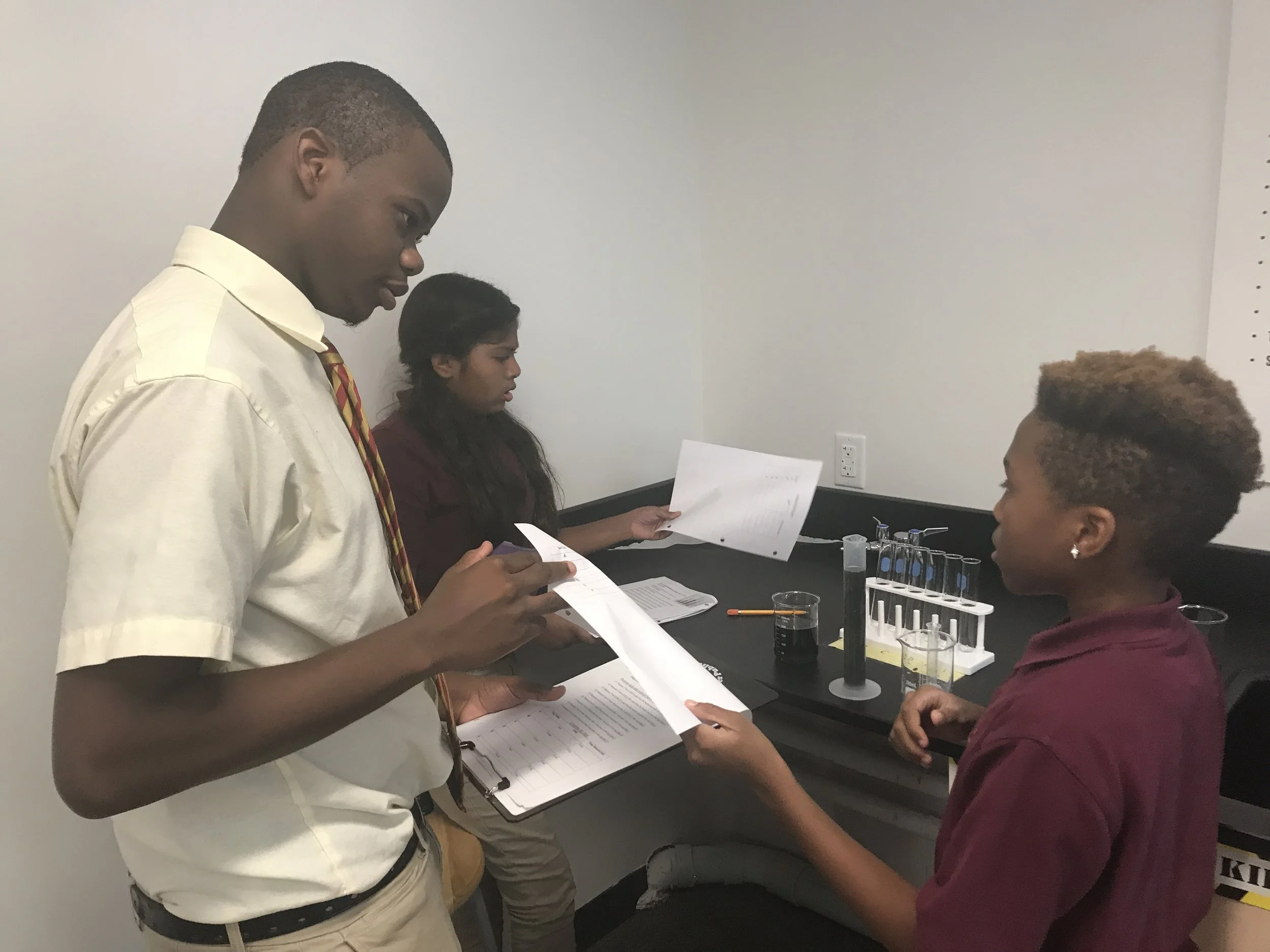 2018.10.24 Travis TAing in 6th grade science.jpeg