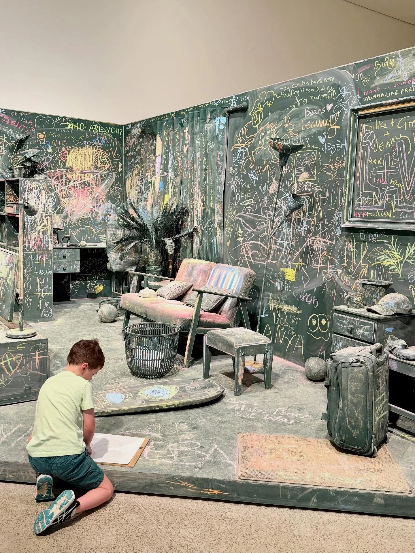 #sydney REVIEW - It Takes a Village at the Art Gallery NSW - Naala Badu building (North). FREE.

The exhibition invites visitors to share the space and add their own little scribble with chalk in the pastel green installation, or wander through and v