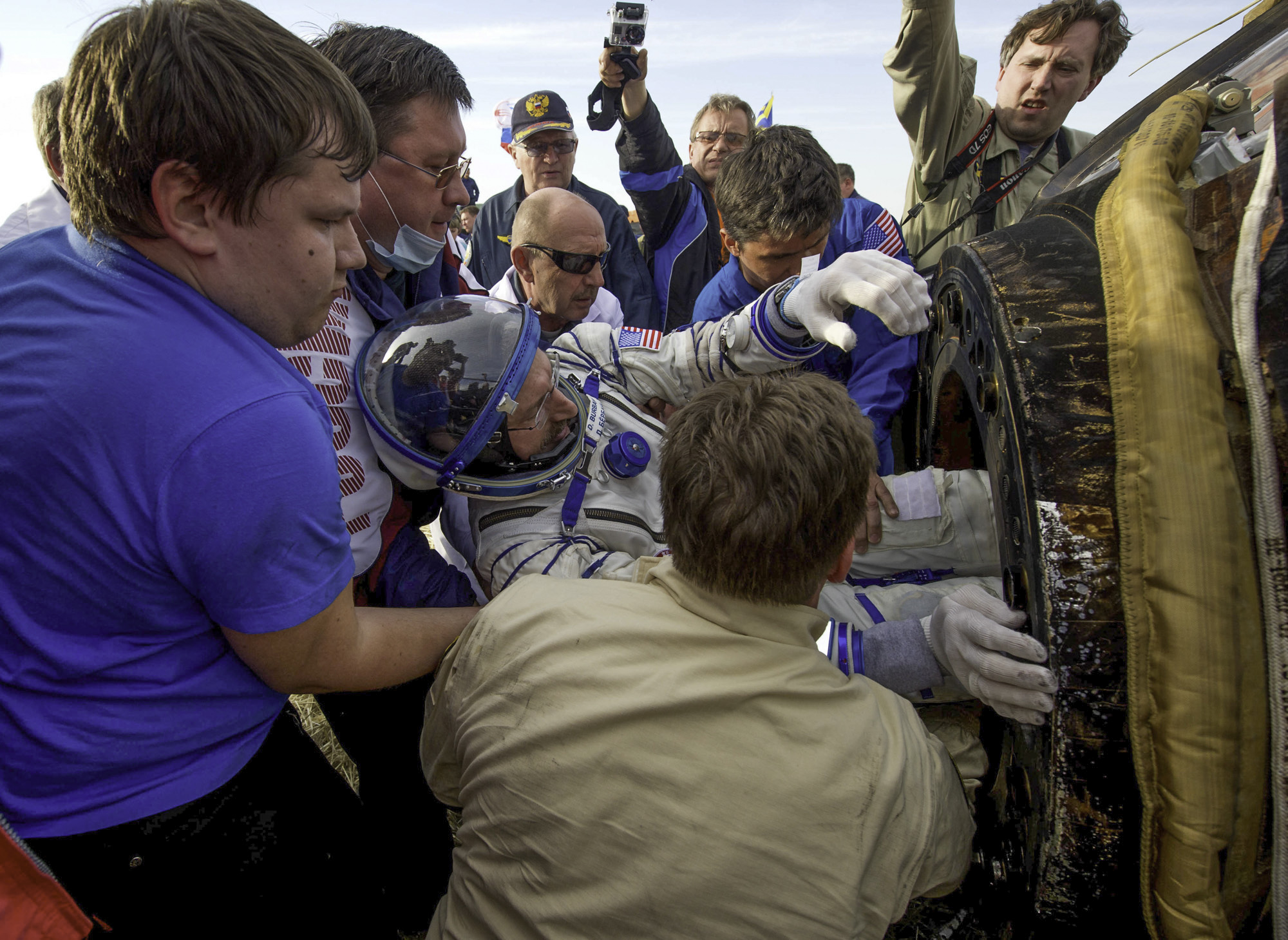  Expedition 30 Commander Dan Burbank is seen as he is extracted from the Soyuz TMA-22 spacecraft shortly after the capsule landed with Russian flight engineers Anton Shkaplerov and Anatoly Ivanishin in a remote area outside of the town of Arkalyk, Ka