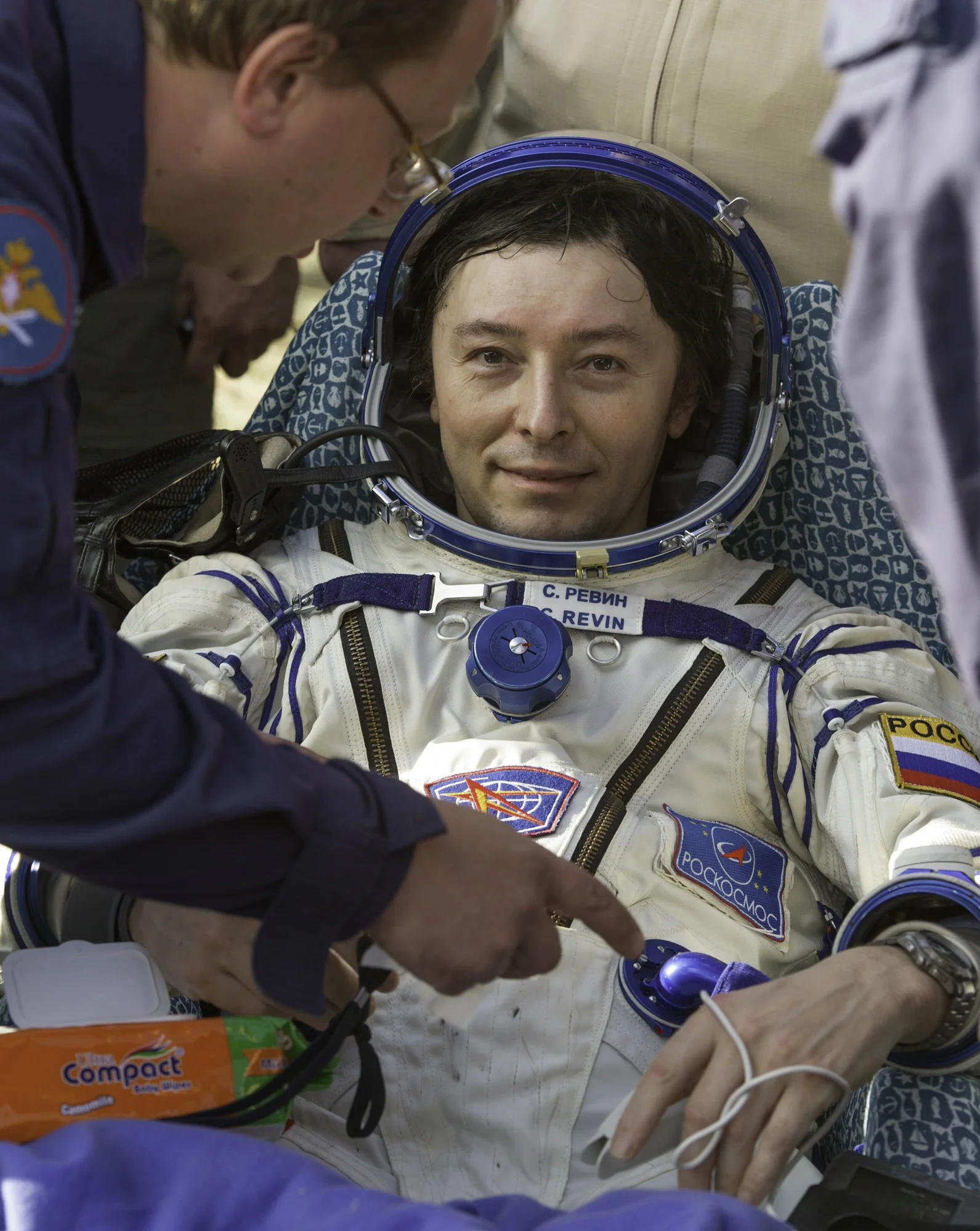 Expedition 32 Russian Flight Engineer Sergei Revin is seen as he rests outside the Soyuz TMA-04M capsule just minutes after he and Expedition 32 Commander Gennady Padalka and NASA Flight Engineer Joe Acaba landed in a remote area outside of the town of Arkalyk, Kazakhstan, on Monday, Sept. 17, 2012. Revin, Padalka and Acaba are returning from five months onboard the International Space Station where they served as members of the Expedition 31 and 32 crews. (NASA/Carla Cioffi)