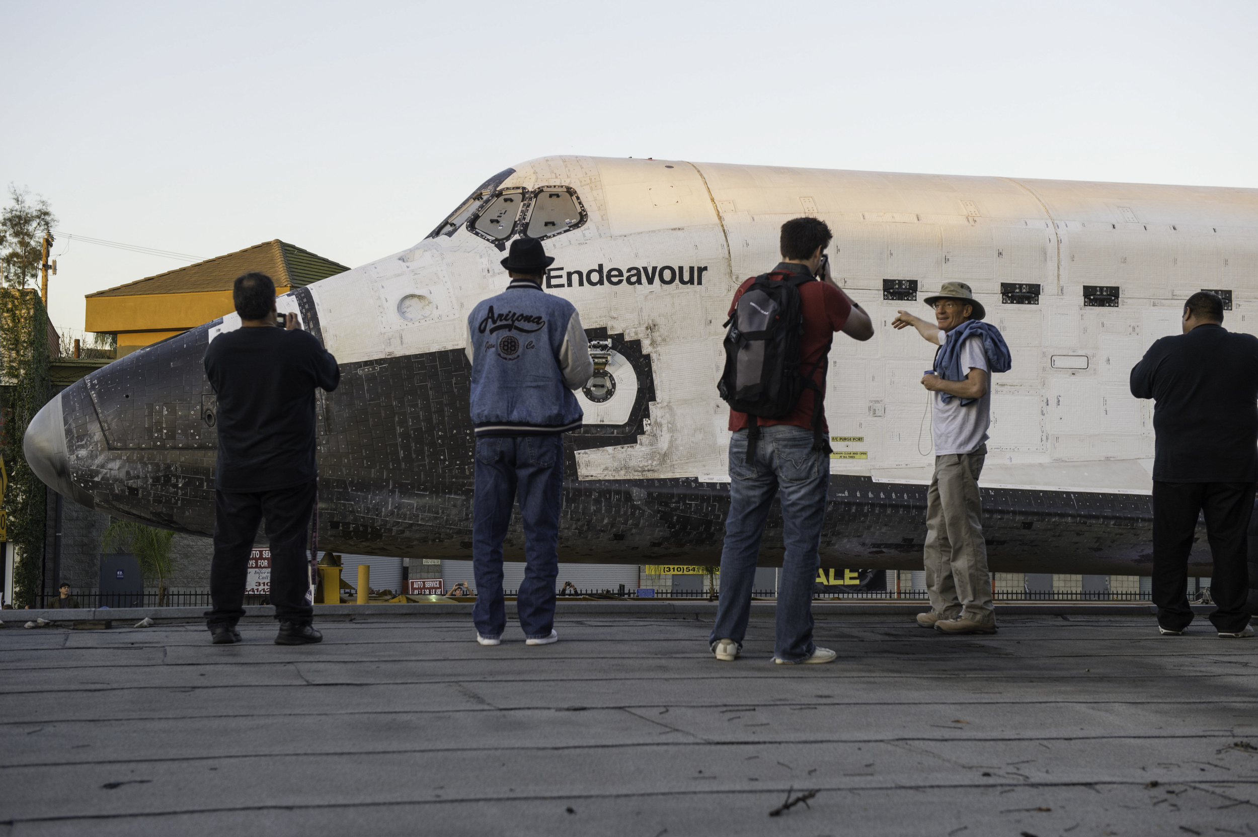 Spectators are seen as they watch space shuttle Endeavour traverse to its new home at the California Science Center in Los Angeles, Saturday, Oct. 13, 2012. Endeavour, built as a replacement for space shuttle Challenger, completed 25 missions, spent