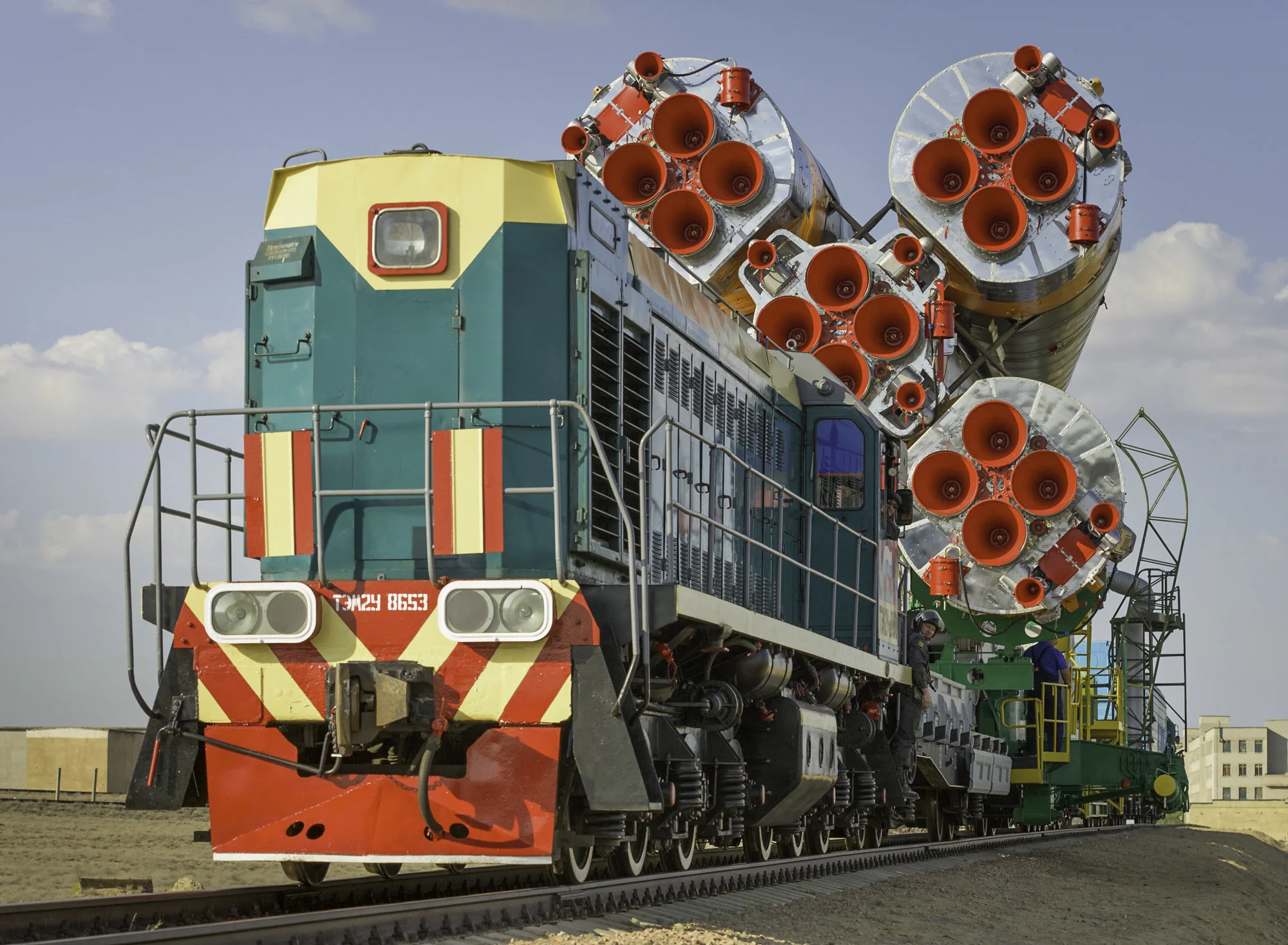 The Soyuz TMA-02M spacecraft is carried by train on its way to the launch pad at the Baikonur Cosmodrome, Kazakhstan, Sunday, June 5, 2011. The launch of the Soyuz spacecraft with Expedition 28 Soyuz Commander Sergei Volkov of Russia, NASA Flight Engineer Mike Fossum and JAXA (Japan Aerospace Exploration Agency) Flight Engineer Satoshi Furukawa is scheduled for 2:15 a.m. local time on Wednesday, June 8, 2011. (NASA/Carla Cioffi)