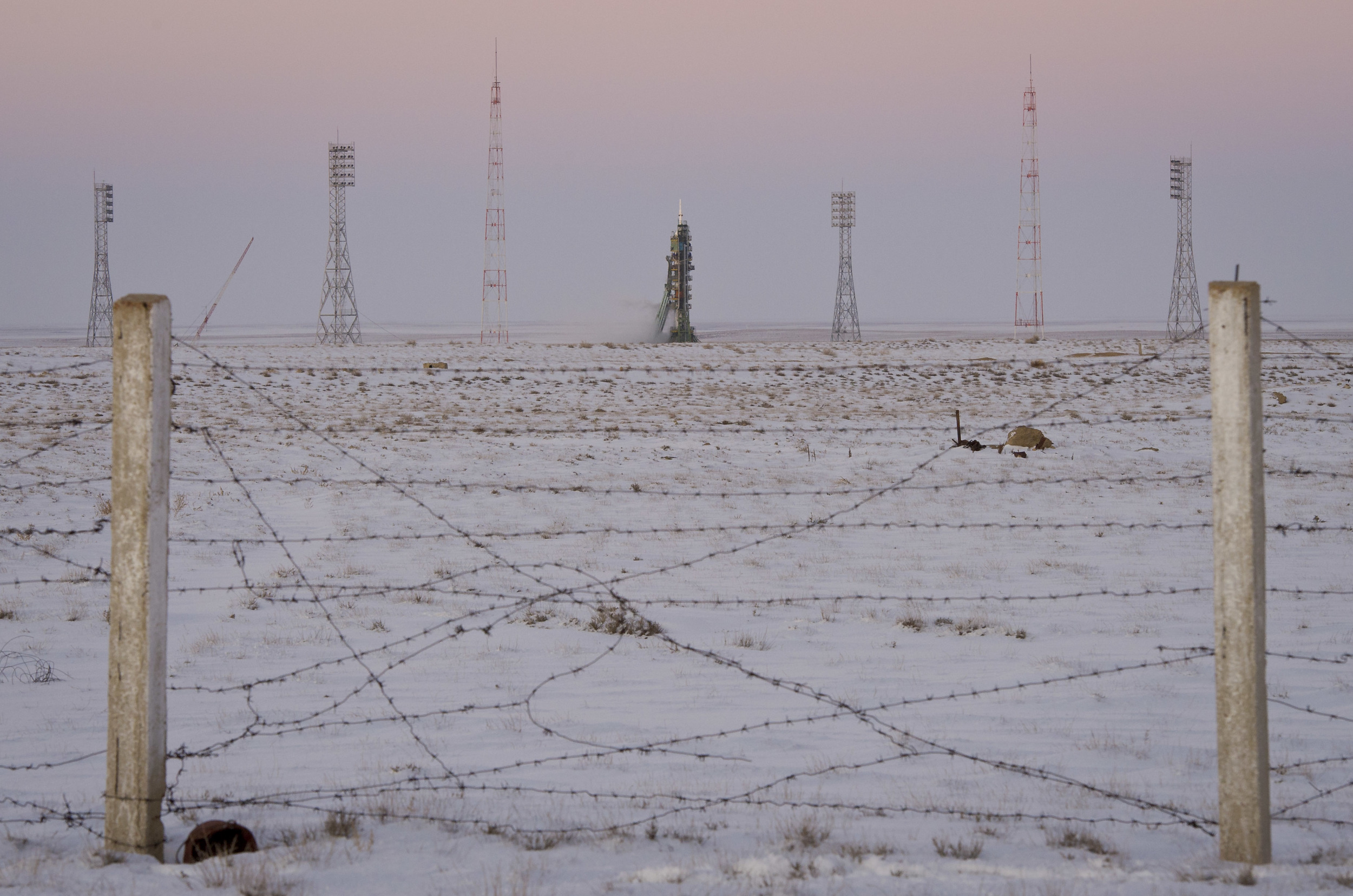  The Soyuz TMA-03M spacecraft is seen at dusk an hour before launch at the Baikonur Cosmodrome in Kazakhstan, Wednesday, Dec. 21, 2011. The crew of Expedition 30, NASA Flight Engineer Don Pettit, Soyuz Commander Oleg Konenko, ESA (European Space Agen