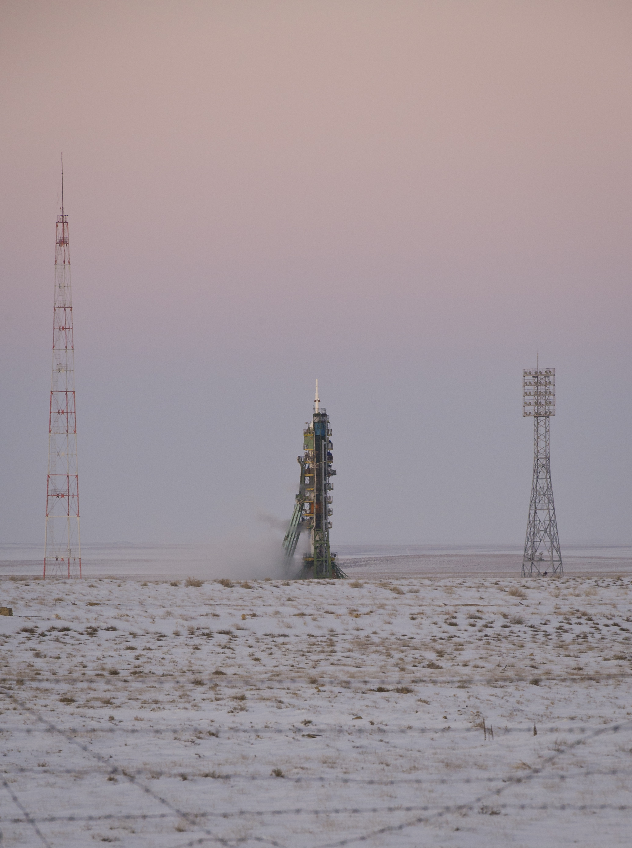 The Soyuz TMA-03M spacecraft is seen at dusk an hour before launch at the Baikonur Cosmodrome in Kazakhstan, Wednesday, Dec. 21, 2011. The crew of Expedition 30, NASA Flight Engineer Don Pettit, Soyuz Commander Oleg Konenko, ESA (European Space Agen
