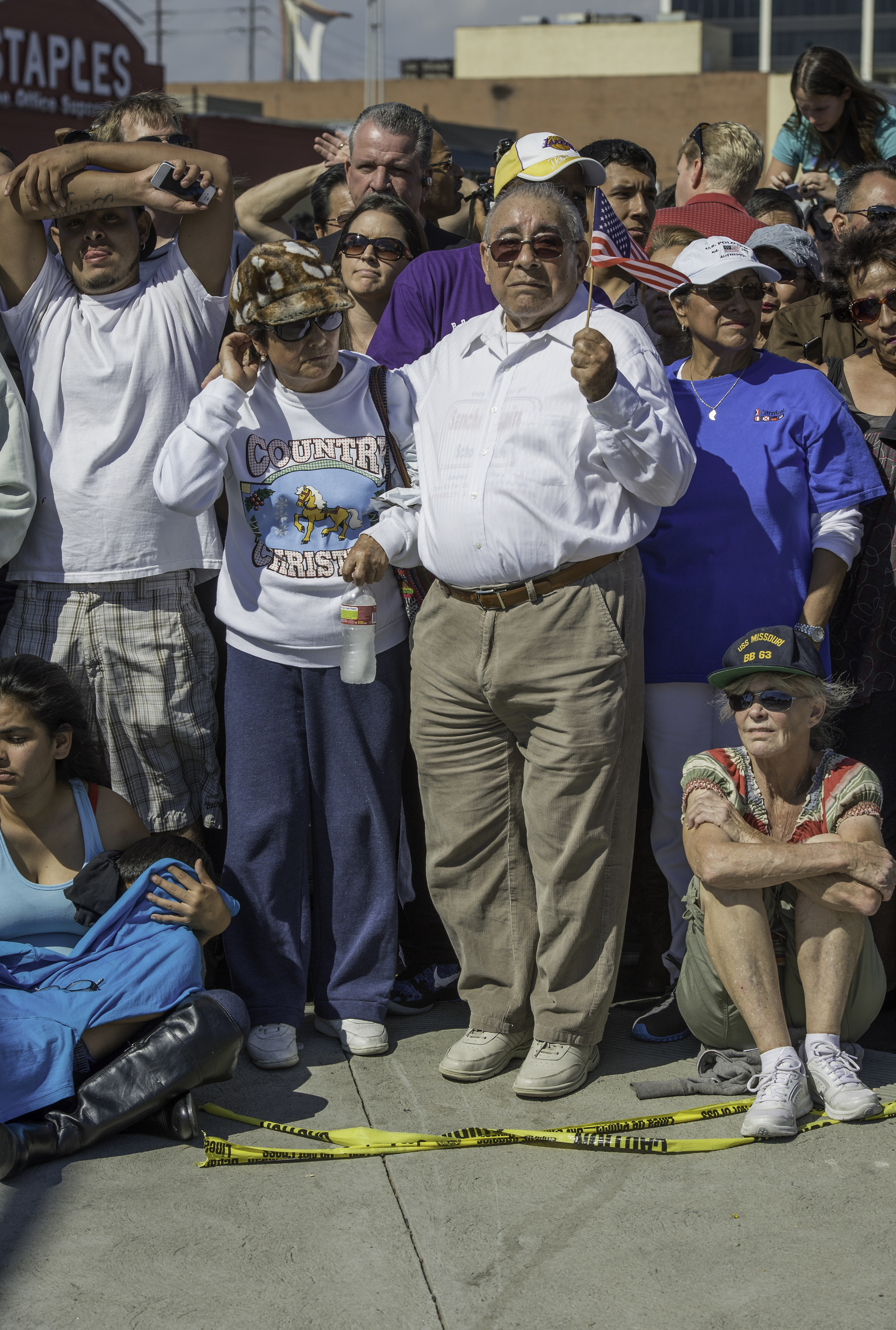 Spectators gather to watch space shuttle Endeavour as it passes by on its way to its new home at the California Science Center in Los Angeles, Friday, Oct. 12, 2012. Endeavour, built as a replacement for space shuttle Challenger, completed 25 missio