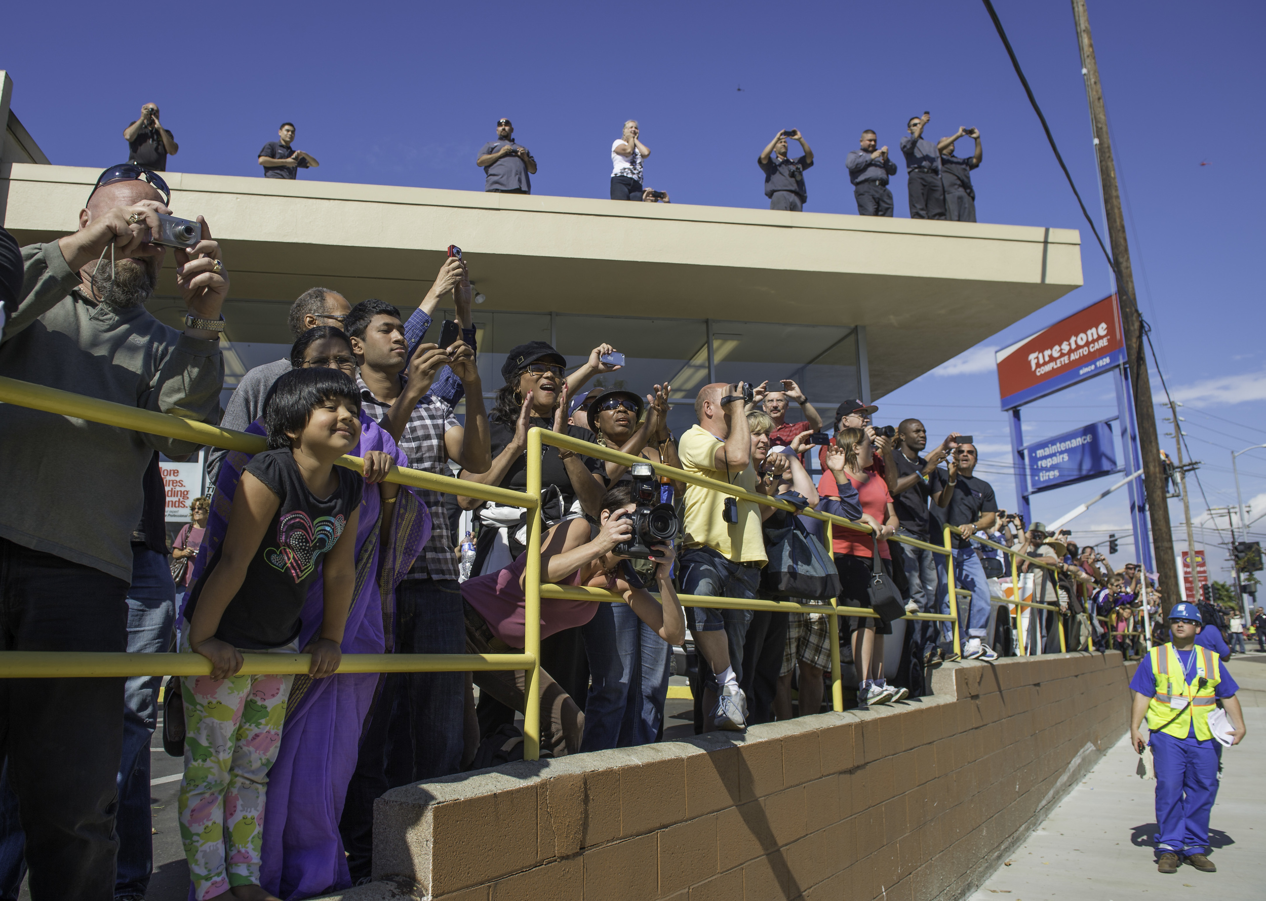  Spectators line up to watch space shuttle Endeavour as it passes by on its way to its new home at the California Science Center in Los Angeles, Friday, Oct. 12, 2012. Endeavour, built as a replacement for space shuttle Challenger, completed 25 missi