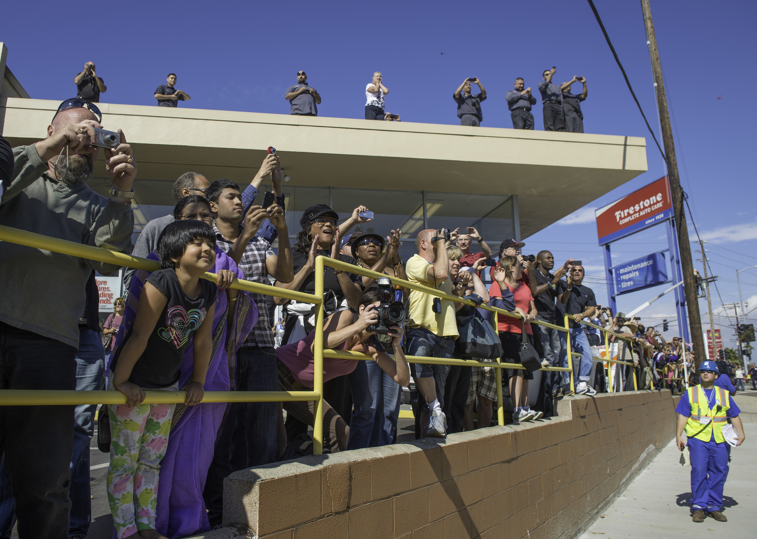 Spectators line up to watch space shuttle Endeavour as it passes by on its way to its new home at the California Science Center in Los Angeles, Friday, Oct. 12, 2012. Endeavour, built as a replacement for space shuttle Challenger, completed 25 missi