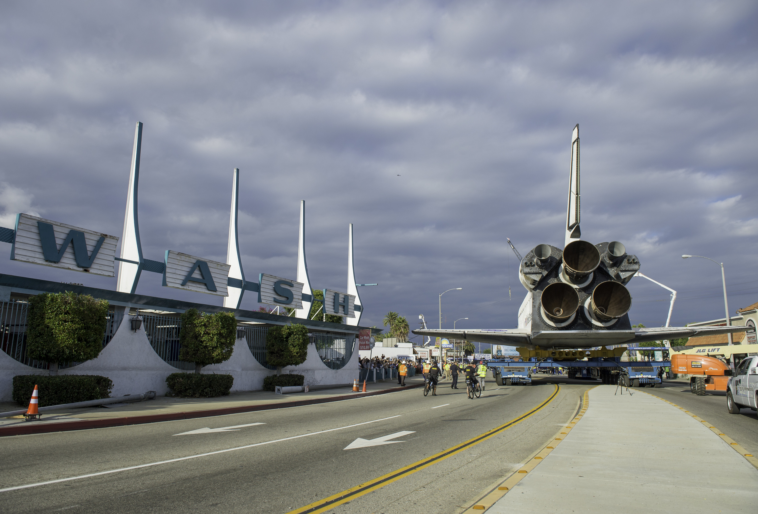 Space shuttle Endeavour is seen passing a car wash on its way to its new home at the California Science Center in Los Angeles, Friday, Oct. 12, 2012. Endeavour, built as a replacement for space shuttle Challenger, completed 25 missions, spent 299 da