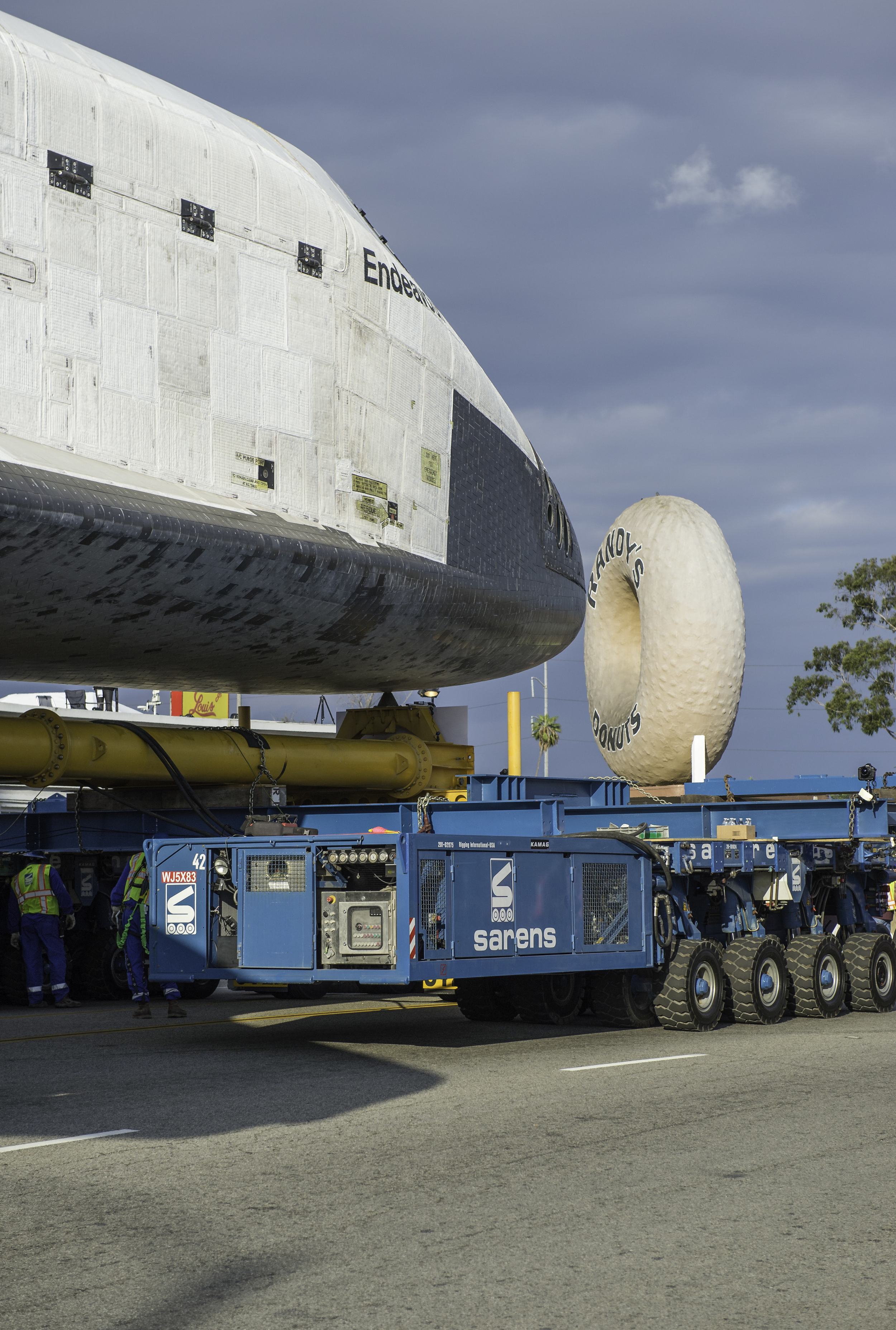 The nose cone of the space shuttle Endeavour is seen next to the Randy’s Donuts landmark in Inglewood, California, Friday, Oct. 12, 2012. Endeavour, built as a replacement for space shuttle Challenger, completed 25 missions, spent 299 days in orbit,
