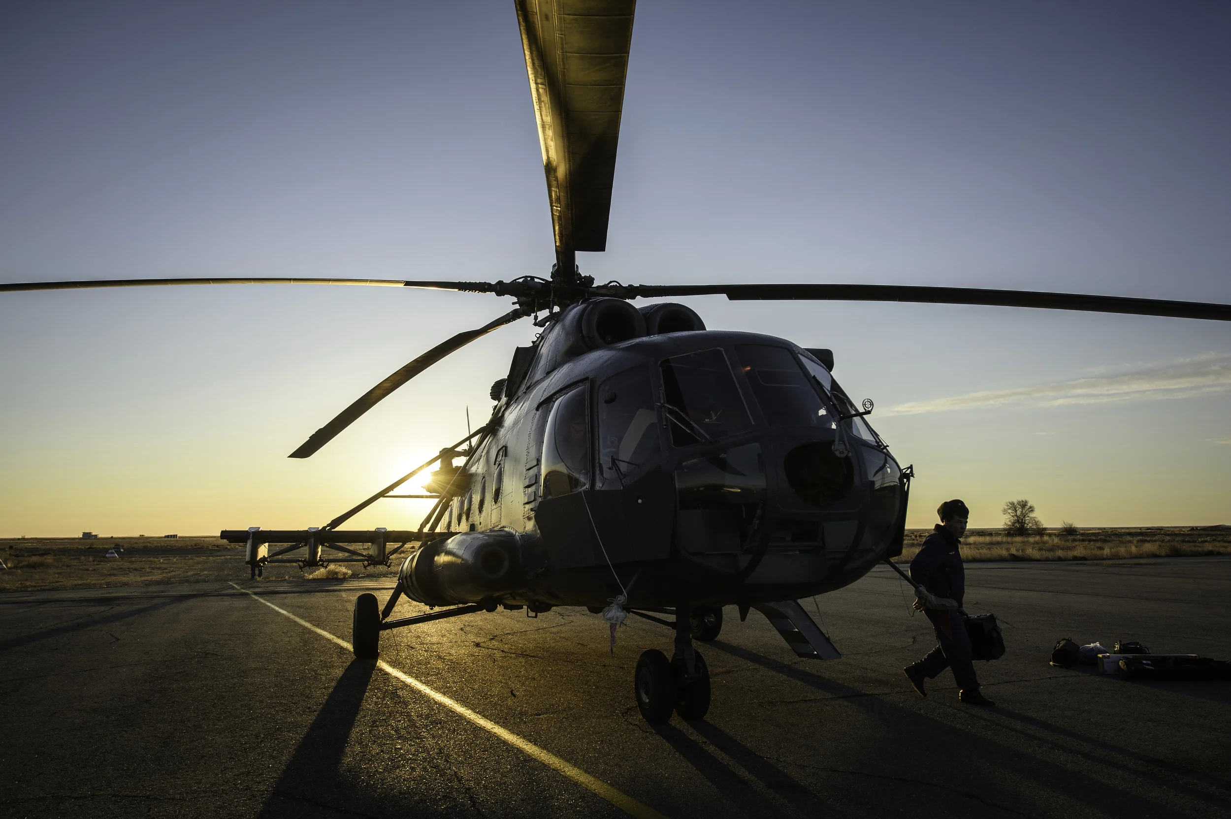 A member of Russian search and rescue exits a helicopter moments after landing at Zhezkazgan airport in Kazakhstan, Sunday, Nov. 10, 2013, a day ahead of the scheduled landing of the Soyuz TMA-09M spacecraft with Expedition 37 Commander Fyodor Yurchikhin of the Russian Federal Space Agency (Roscosmos), Flight Engineer Karen Nyberg of NASA and Flight Engineer Luca Parmitano of the European Space Agency. Yurchikhin, Nyberg and Parmitano are returning to Earth after five and a half months on the International Space Station. (NASA/Carla Cioffi)