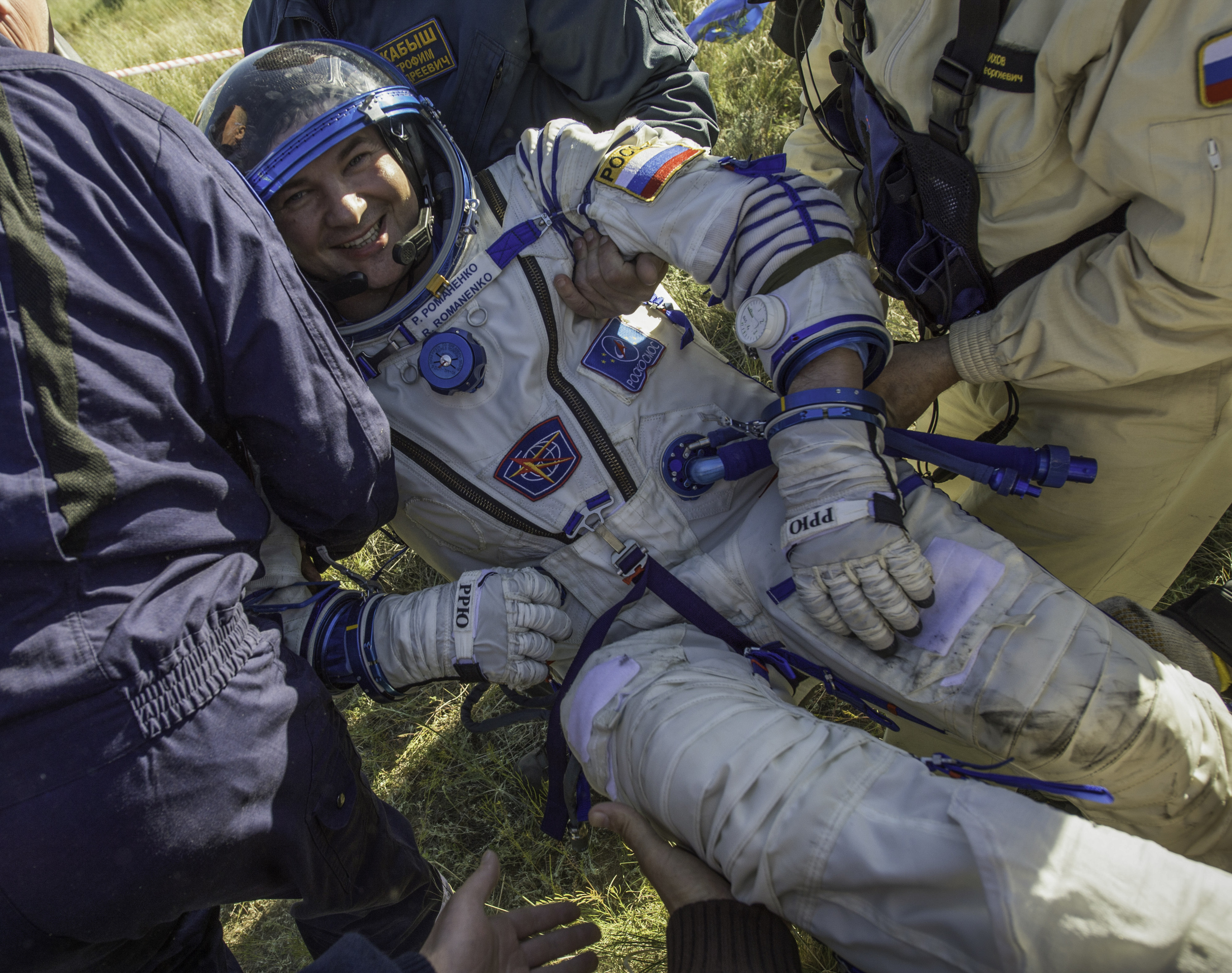  Expedition 35 Flight Engineer and Russian cosmonaut Roman Romanenko is seen smiling as he is carried after being extracted from the Soyuz TMA-07M spacecraft shortly after the capsule landed with Expedition 35 Commander Chris Hadfield of the Canadian