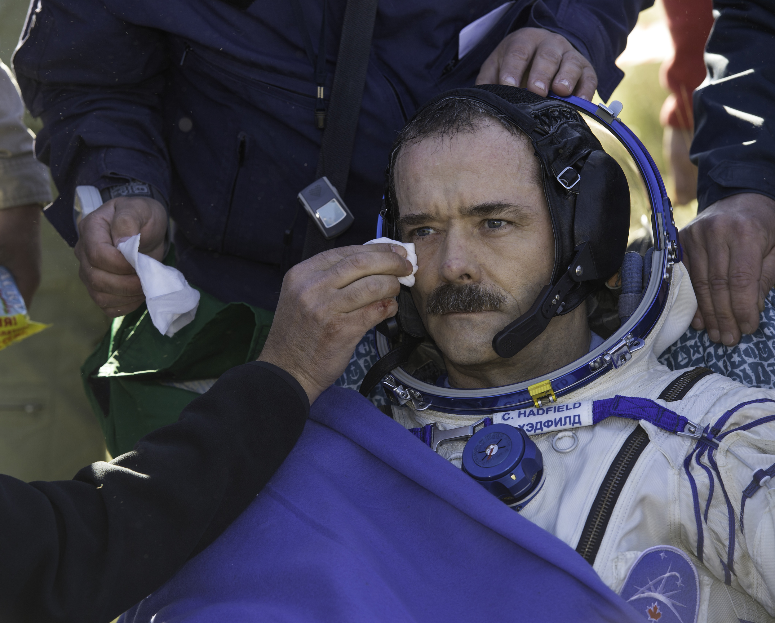  Expedition 35 Commander Chris Hadfield of the Canadian Space Agency (CSA) is attended to following his landing in the Soyuz TMA-07M spacecraft in a remote area near the town of Zhezkazgan, Kazakhstan, Tuesday, May 14, 2013. Hadfield and crew mates N