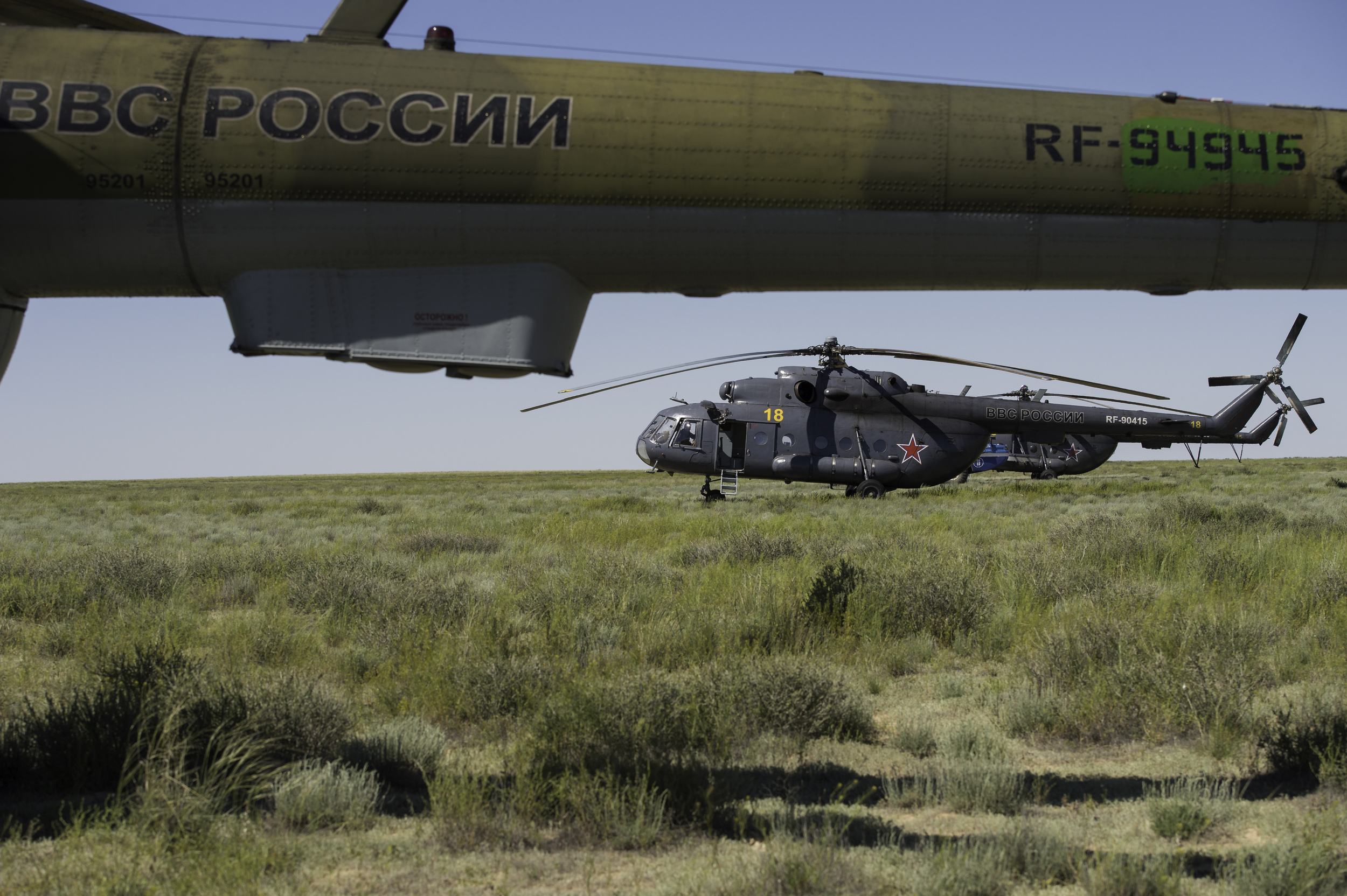  Russian Search and Rescue Helicopters are seen as they await departure from the landing zone in a remote area near the town of Zhezkazgan, Kazakhstan following the the landing of the Soyuz TMA-07M spacecraft on Tuesday, May 14, 2013. The Soyuz space