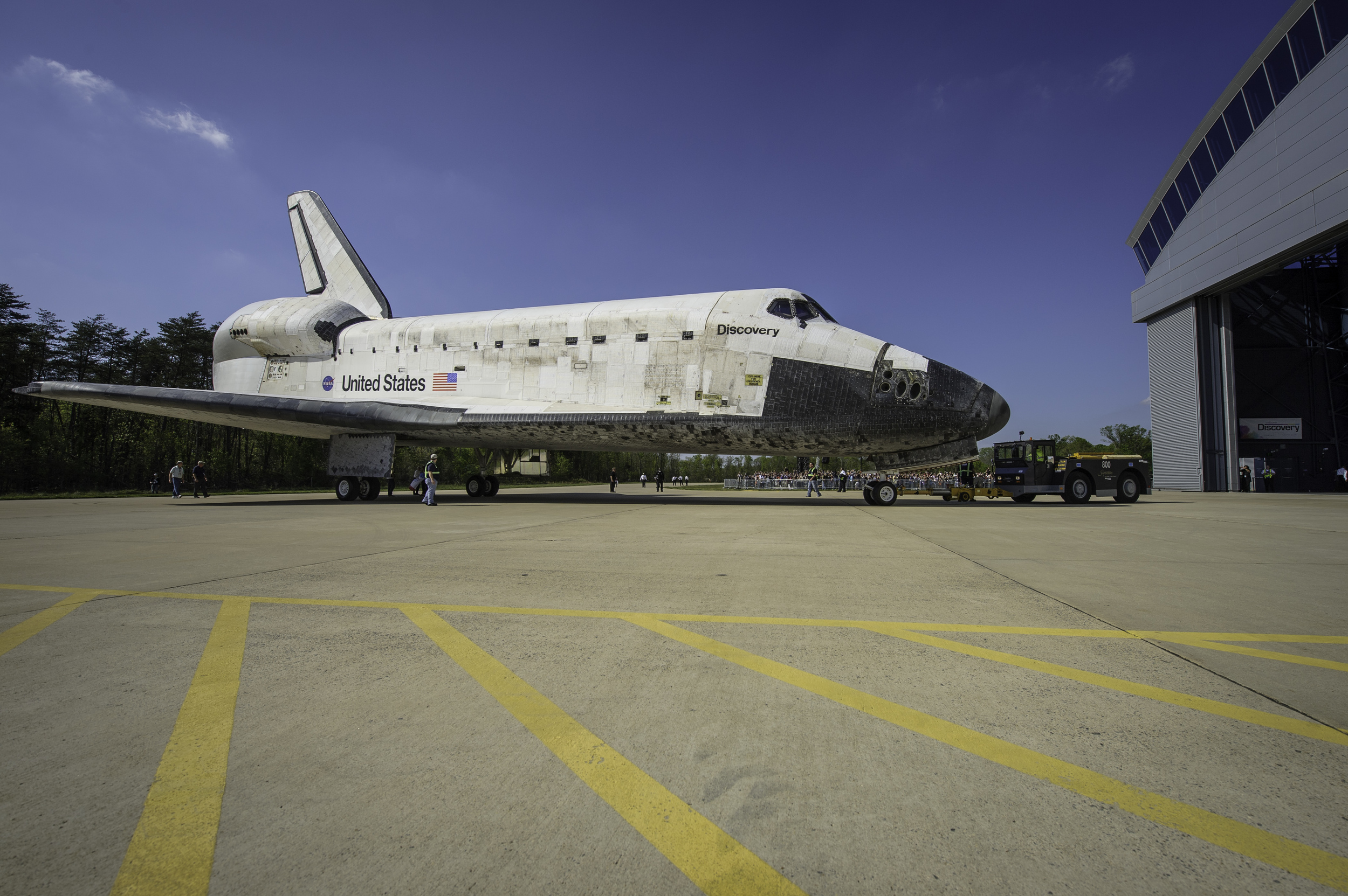  Space shuttle Discovery is rolled into its hangar at the Steven F. Udvar-Hazy Center Thursday, April 19, 2012 in Chantilly, Va. Discovery will be permanently housed at the Udvar-Hazy Center, part of the Smithsonian Institution’s Air and Space Museum