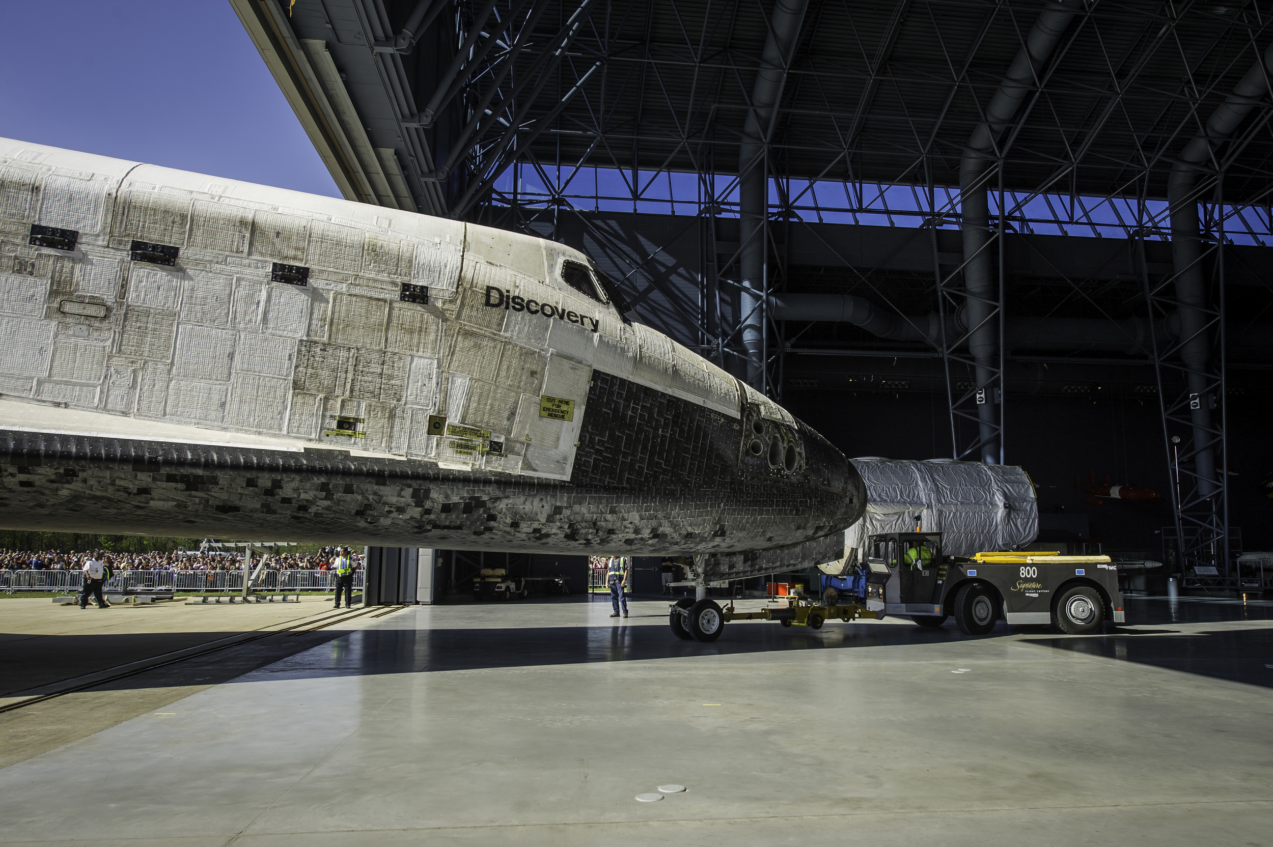  Space shuttle Discovery is rolled into its hangar at the Steven F. Udvar-Hazy Center Thursday, April 19, 2012 in Chantilly, Va. Discovery will be permanently housed at the Udvar-Hazy Center, part of the Smithsonian Institution’s Air and Space Museum