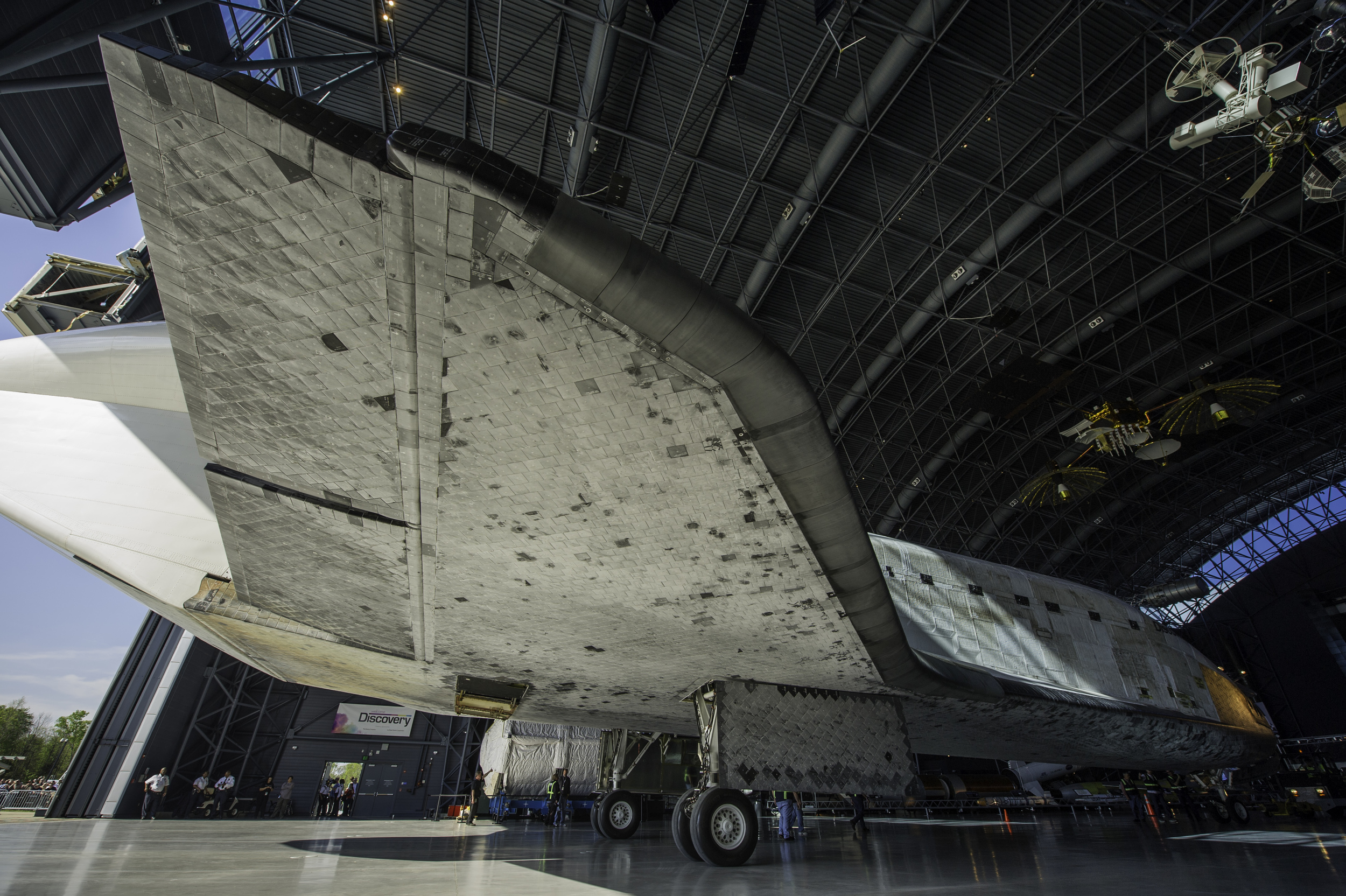  Space shuttle Discovery is rolled into its hangar at the Steven F. Udvar-Hazy Center Thursday, April 19, 2012 in Chantilly, Va. Discovery will be permanently housed at the Udvar-Hazy Center, part of the Smithsonian Institution’s Air and Space Museum