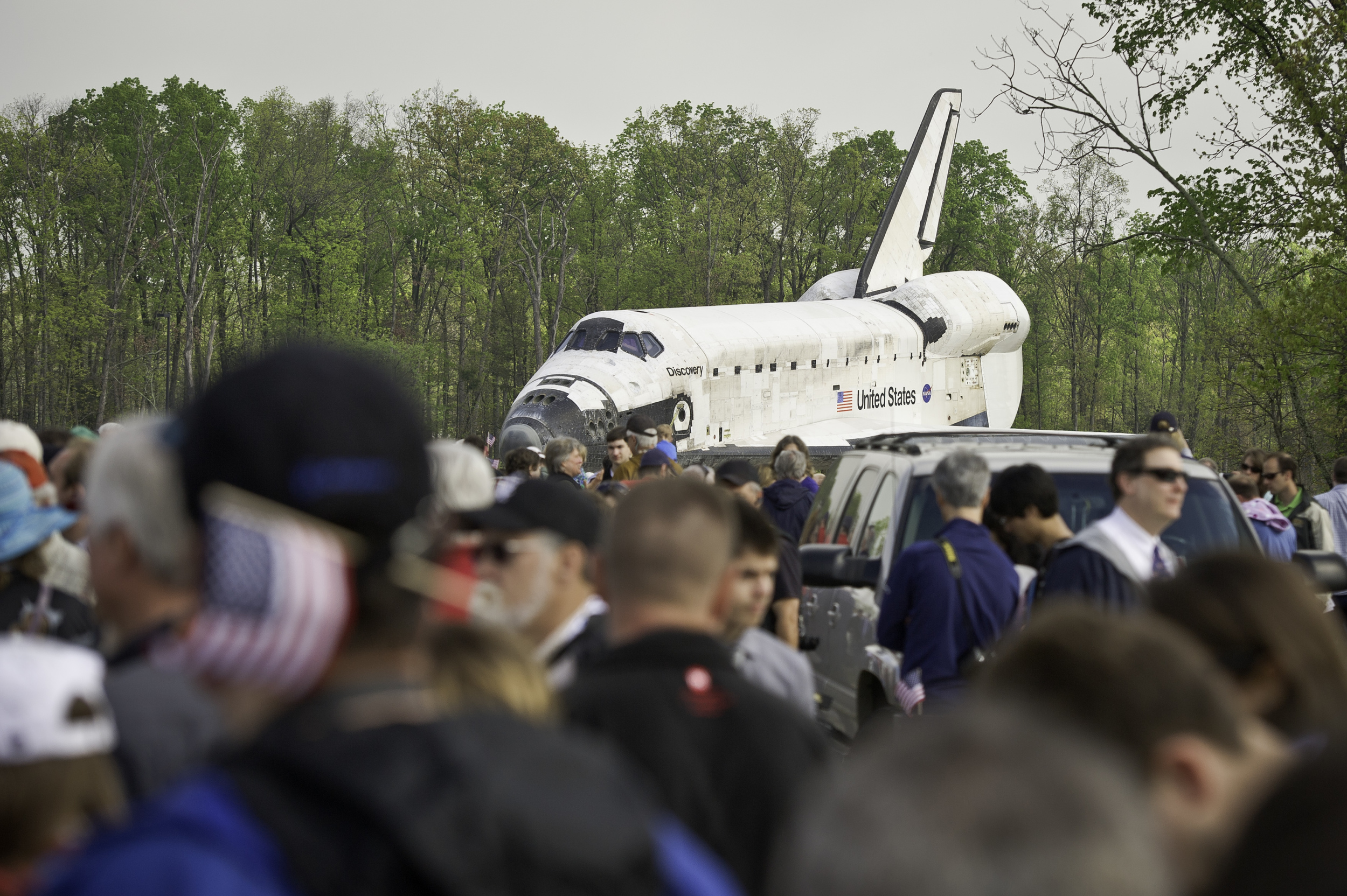 Space shuttle Discovery is rolled toward the transfer ceremony at the Steven F. Udvar-Hazy Center Thursday, April 19, 2012 in Chantilly, Va. Discovery will be permanently housed at the Udvar-Hazy Center, part of the Smithsonian Institution’s Air and