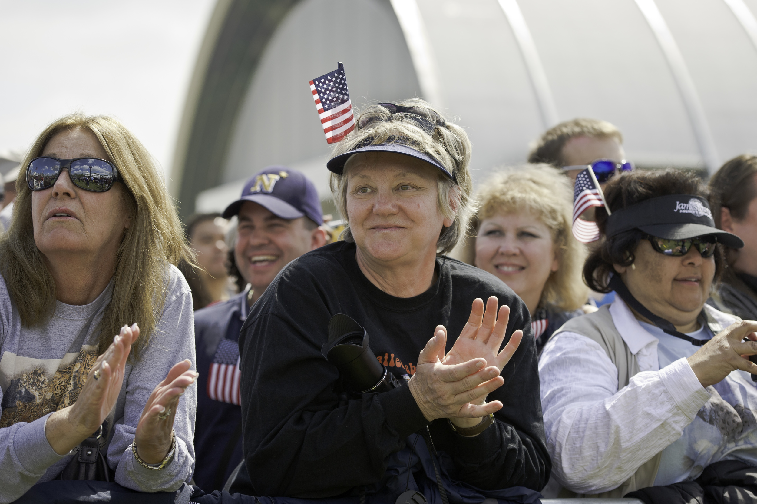  Bettye Kozlowski, center, and Francesca Wright, right, from Santa Clarita, CA attend the transfer ceremony for space shuttle Discovery, Thursday, April 19, 2012, at the Smithsonian's Steven F. Udvar-Hazy Center in Chantilly, Va. Discovery, the first