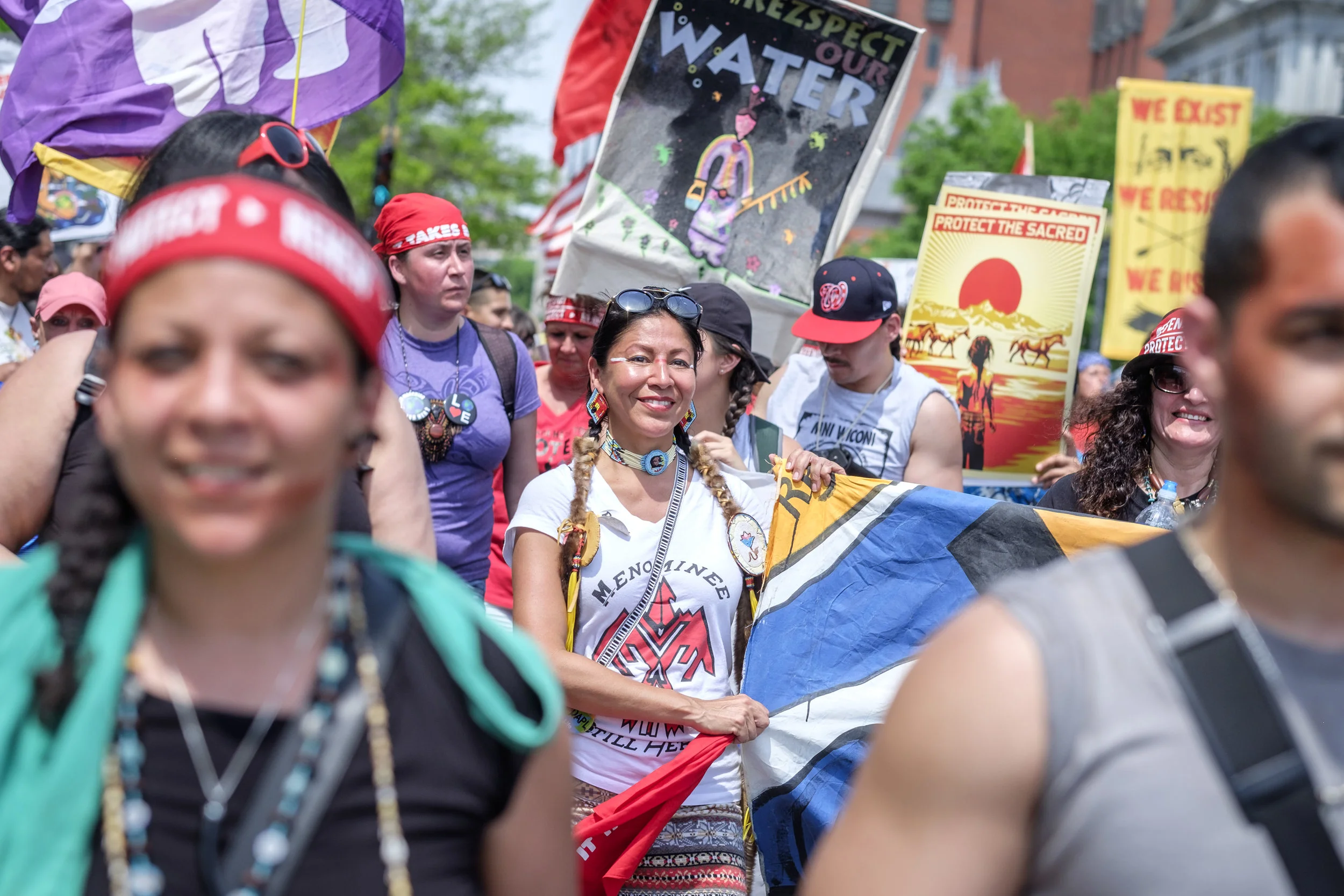 Marla Mahkimetas, center, a member of the Menominee Indian Tribe of Wisconsin, is seen marching in the Protectors of Justice contingency at the Peoples Climate March in Washington, DC on Saturday, April 29, 2017. She and her people are fighting the Back 40 proposed open pit mine on the border of Wisconsin and Upper Michigan. “We are here to teach non-indigenous people about the connection to our earth and water,” she said. “And with that connection, if you know that connection, as indigenous people that is our innate knowing, and our innate responsibility to teach that. People with that connection will no longer destroy the earth or the water.” The Peoples Climate March took place on the 100th day of Donald Trump’s presidency. Marchers surrounded the White House in a silent sit-in to recognize the damage caused by the Trump administration over the last 100 days.