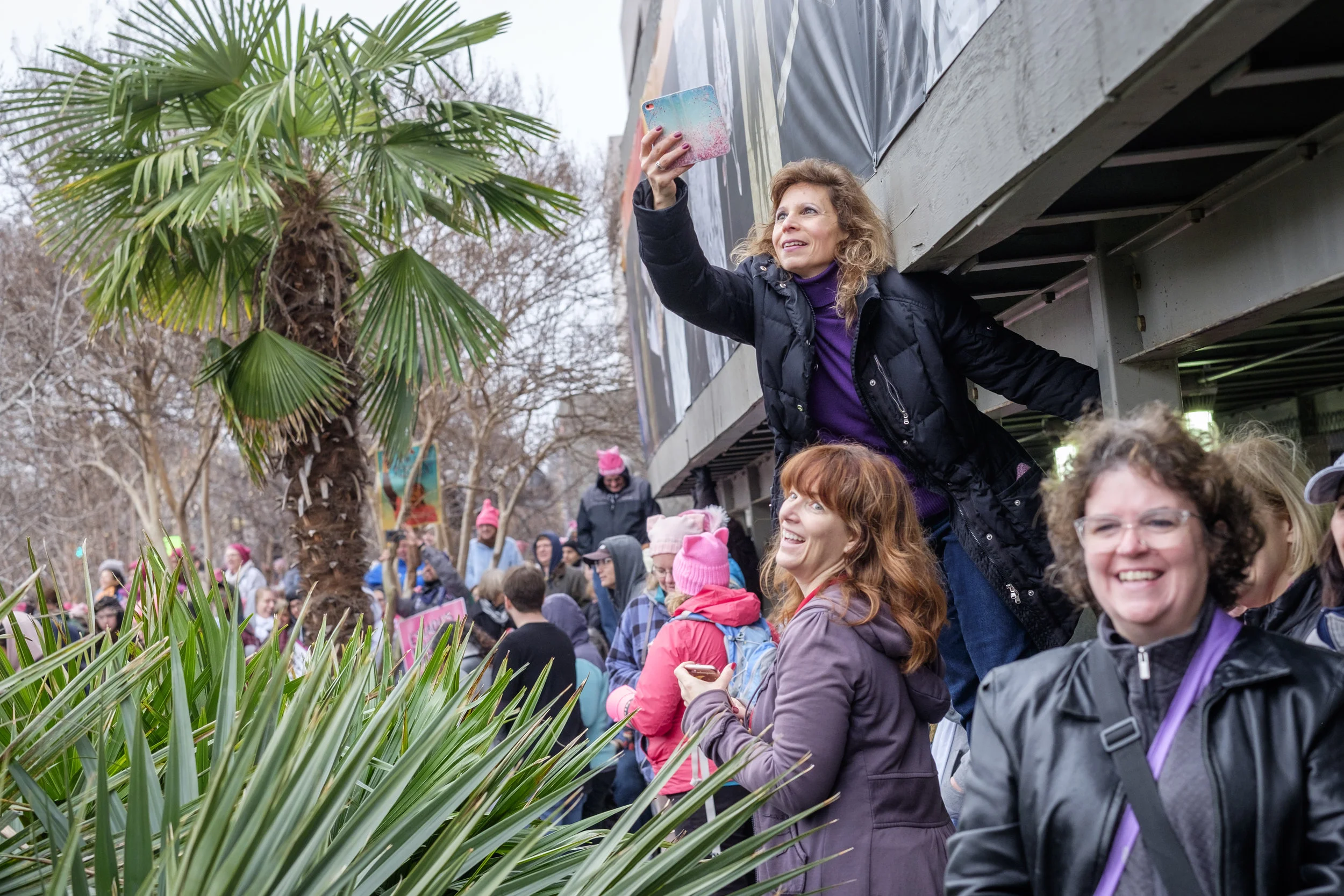 A woman is seen making photographs with her cell phone at The Women's March in Washington, DC on Saturday, January 21, 2017. The day after Donald Trump's inauguration as 45th U.S. president it is estimated that at least 500,000 people marched in The Women’s March on Washington, and 1 million people world-wide. People came together to proclaim unity and to stand firm on the principles of human rights. “Women’s Rights are Human Rights and Human Rights are Women’s Rights.”
