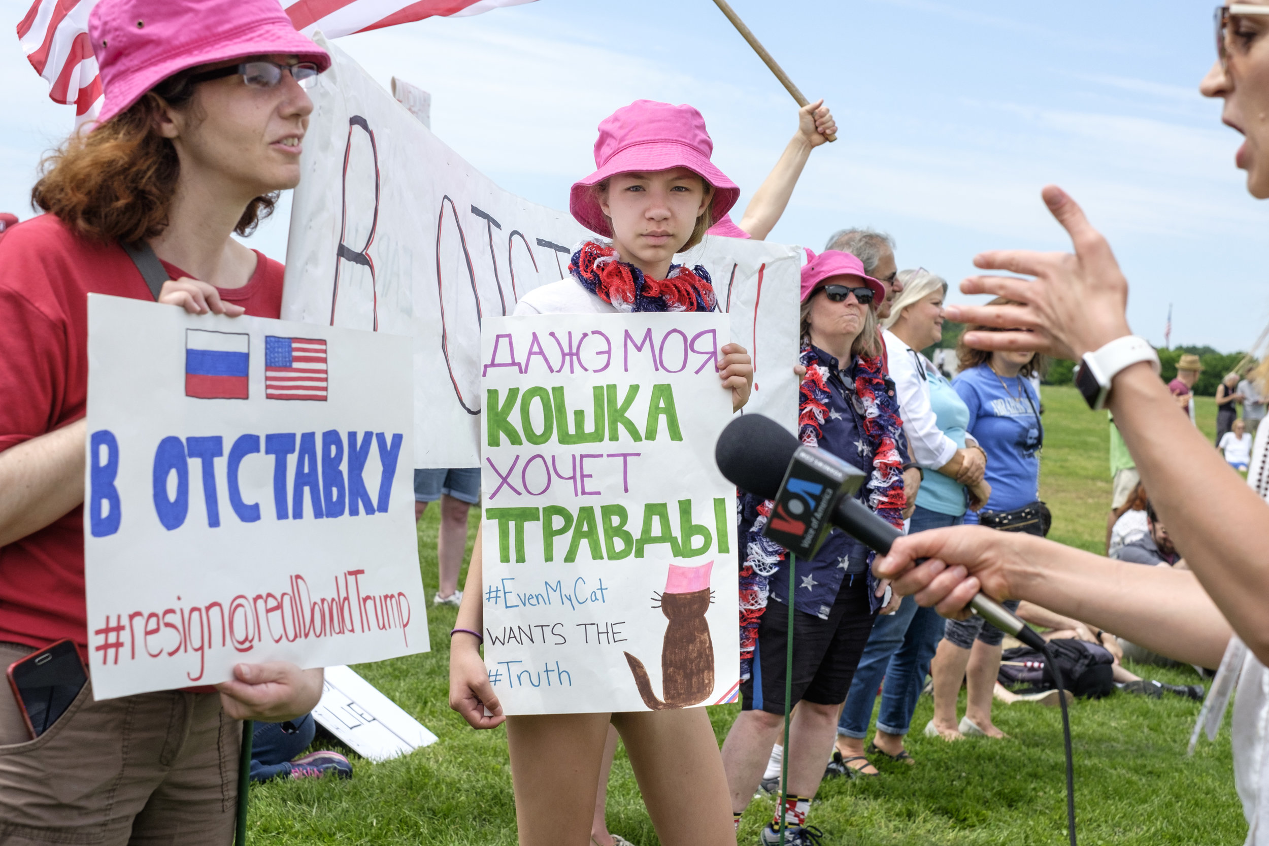 Maddie Smith of Maryland, center, is seen at the March for Truth DC rally held on the National Mall on Saturday, June 3, 2017 in Washington, DC. When asked why she attended the protest she said simply, “I’m pro-Truth.” Her sign, written in both Russian and English, states "Even My Cat Wants the Truth."