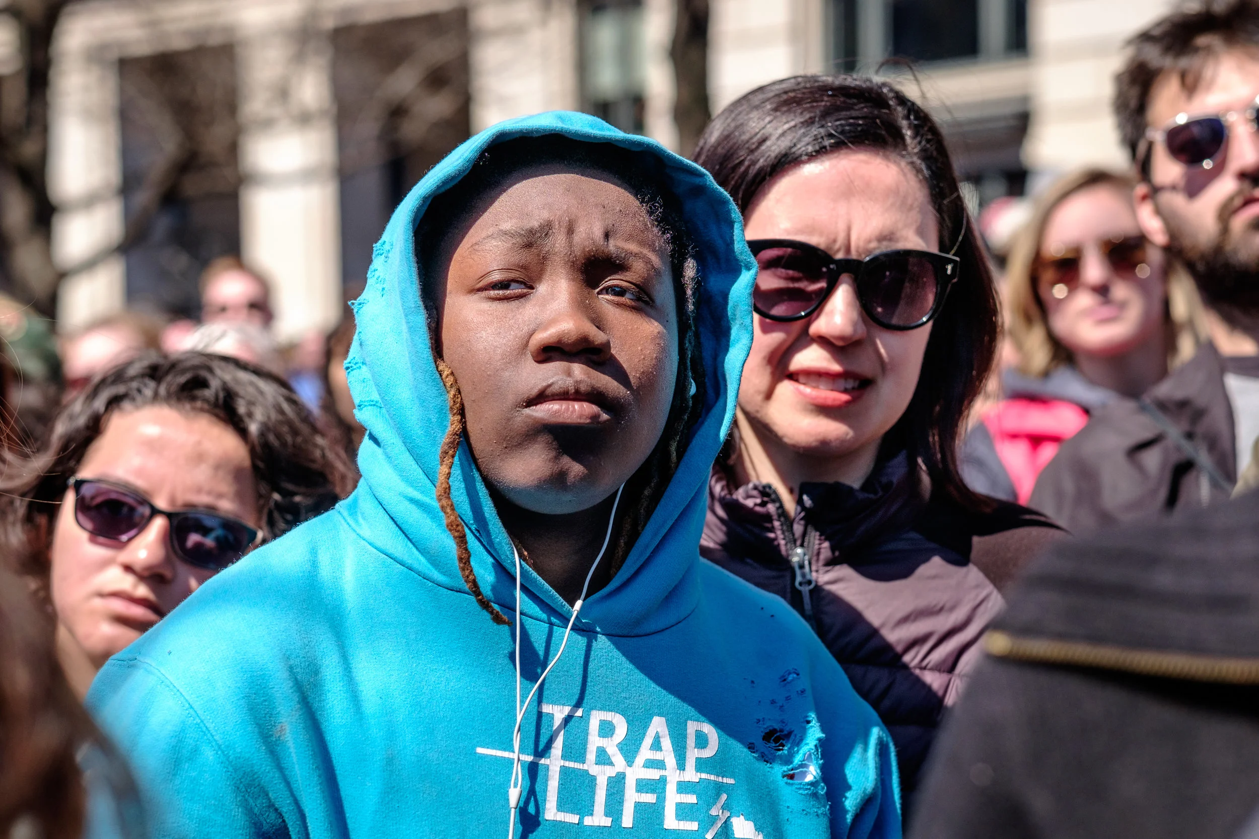 Ty’Shanna Johnson, a high school student from Washington, DC is seen listening to speakers at the March for Our Lives Rally on Saturday, March 24, 2018 in Washington, DC. She shared the following with me, “I’m here to help as much as I can. I hope to stop gun violence, because I grew up in a neighborhood where I witnessed people dying and all that. I lost a few friends. I lost my best friend. Lost everybody that I really was close to. I don’t want everybody else to go through that. So I’m here to support as much as I can.” March For Our Lives is a student-led movement to end gun violence in the United States. Hundreds of thousands of people took to the streets of Washington, DC to demand that peoples’ lives and safety become a priority and to put an end to gun violence in communities and schools immediately. Over 800 sibling marches took place across the U.S. and internationally.