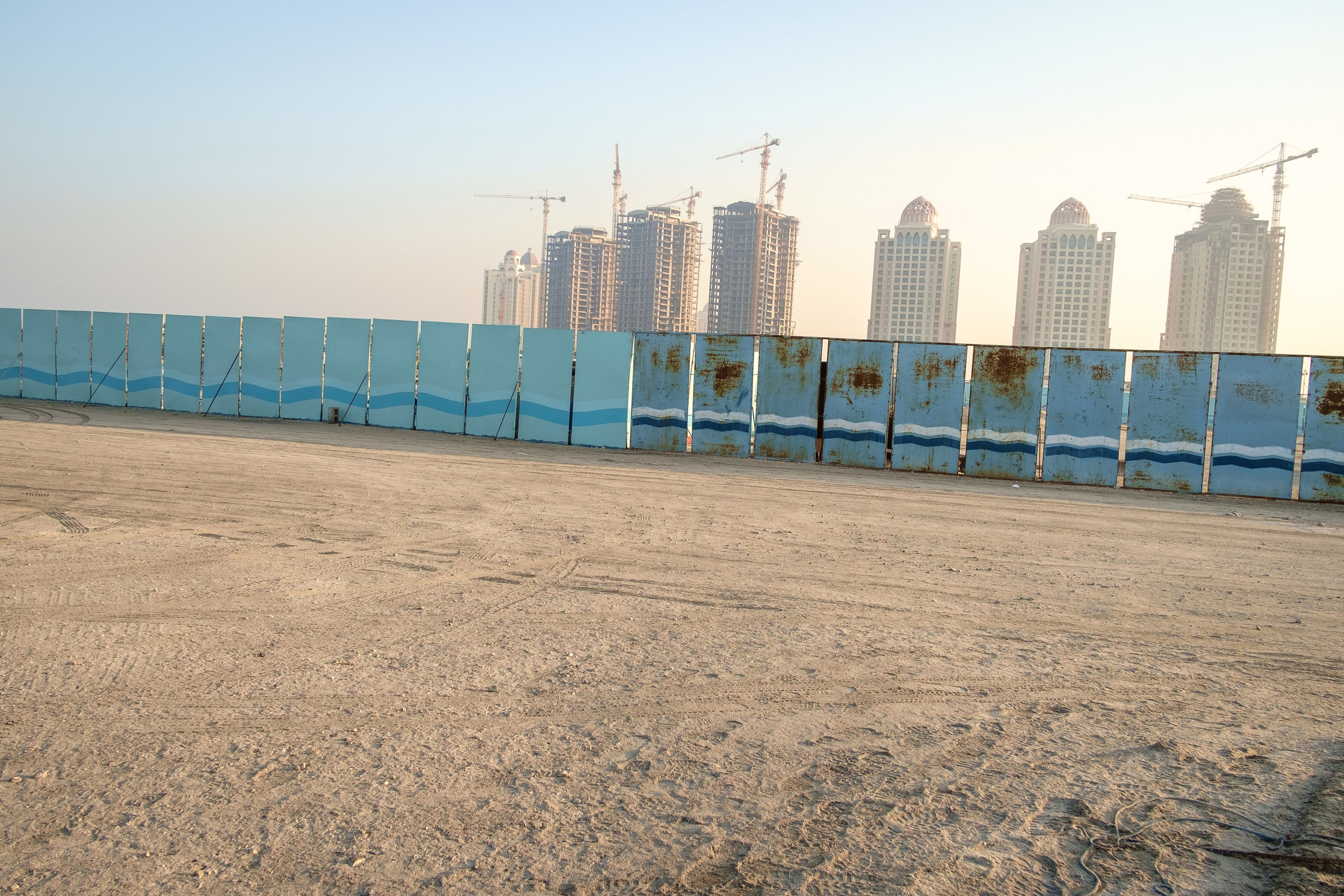  A construction scene on The Pearl with the Viva Bahriya Towers residential development in the background. The Pearl is an artificial island comprising of luxury residential estates and businesses. It is the first land in Qatar made available for own