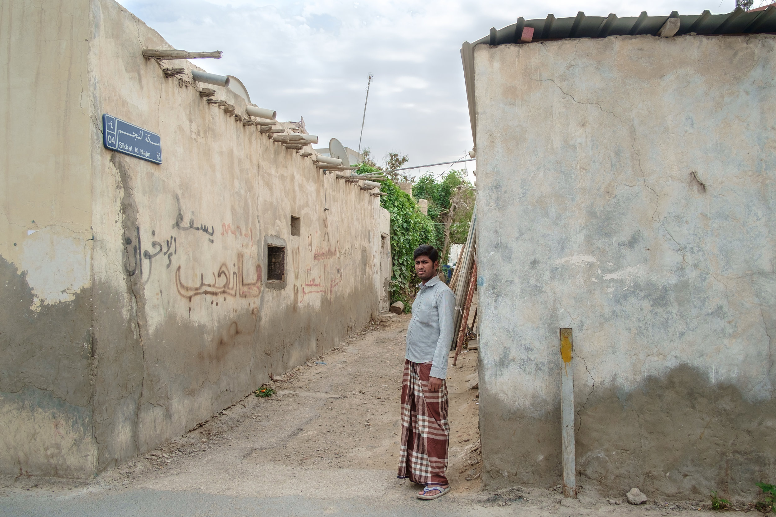 A blue-collar expat is seen in the old Musheireb neighborhood of Doha. Much of this neighborhood has been torn down, and the residents forcibly removed, in order to build the New Msheireb development. Qatar is in a race to revitalize and modernize i