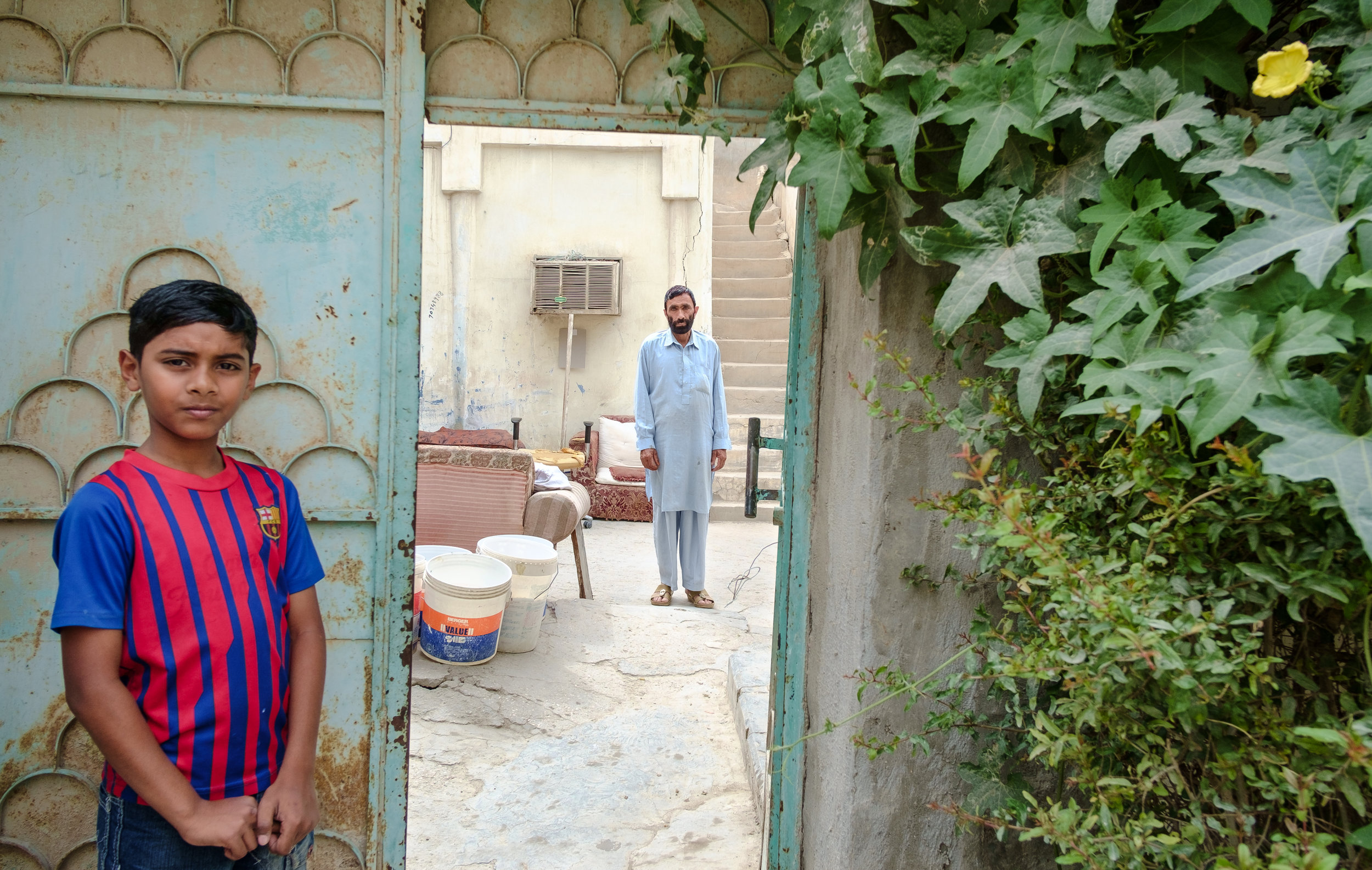  A boy and his neighbor are seen in the old Musheireb neighborhood of Doha. Much of this neighborhood has been torn down, and the residents forcibly removed, in order to build the New Msheireb development. Qatar is in a race to revitalize and moderni