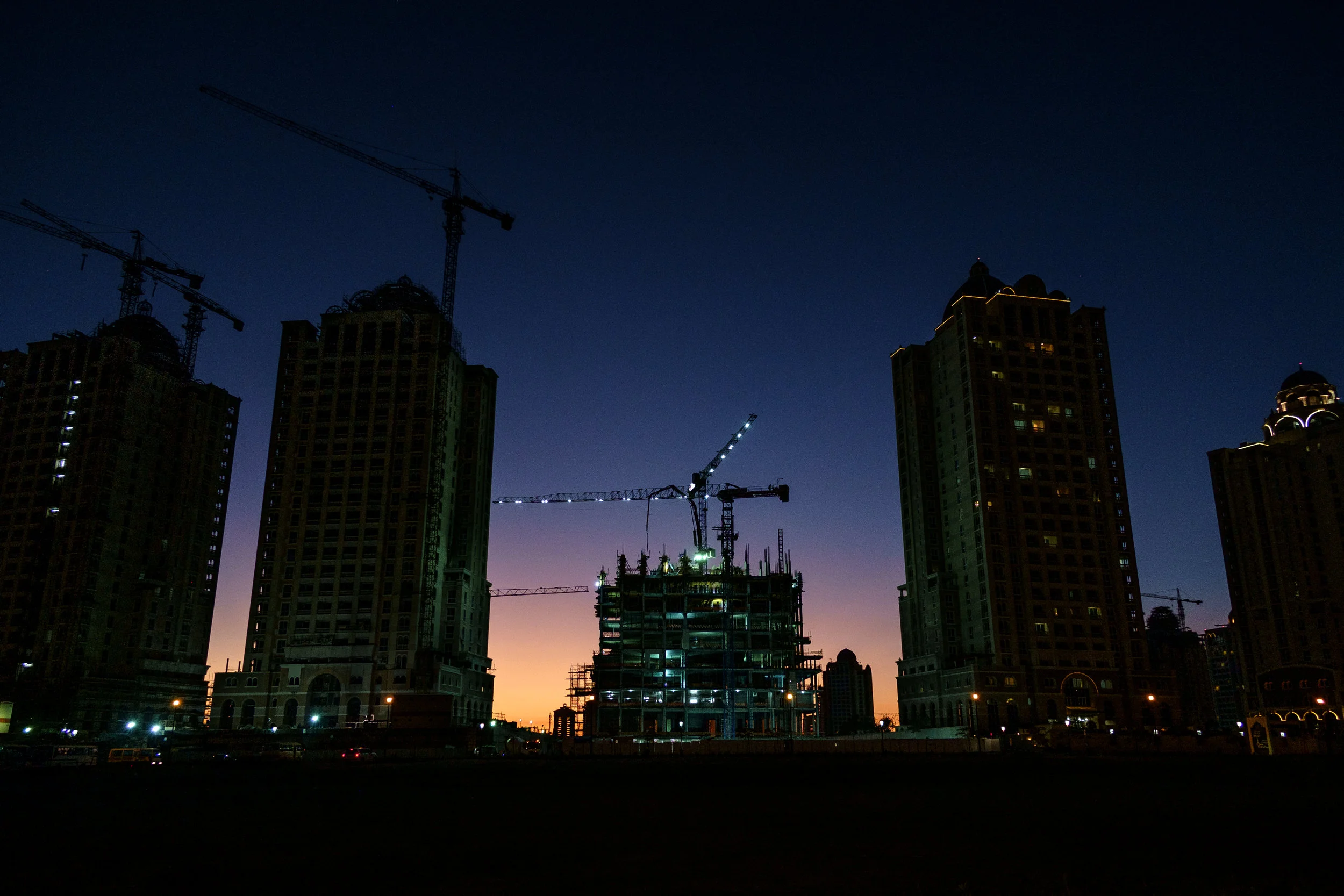 Construction of a residential tower at the Viva Bahriya development on The Pearl is seen in the evening. The Pearl is an artificial island comprising of luxury residential estates and businesses. It is the first land in Qatar made available for ownership by foreign nationals.