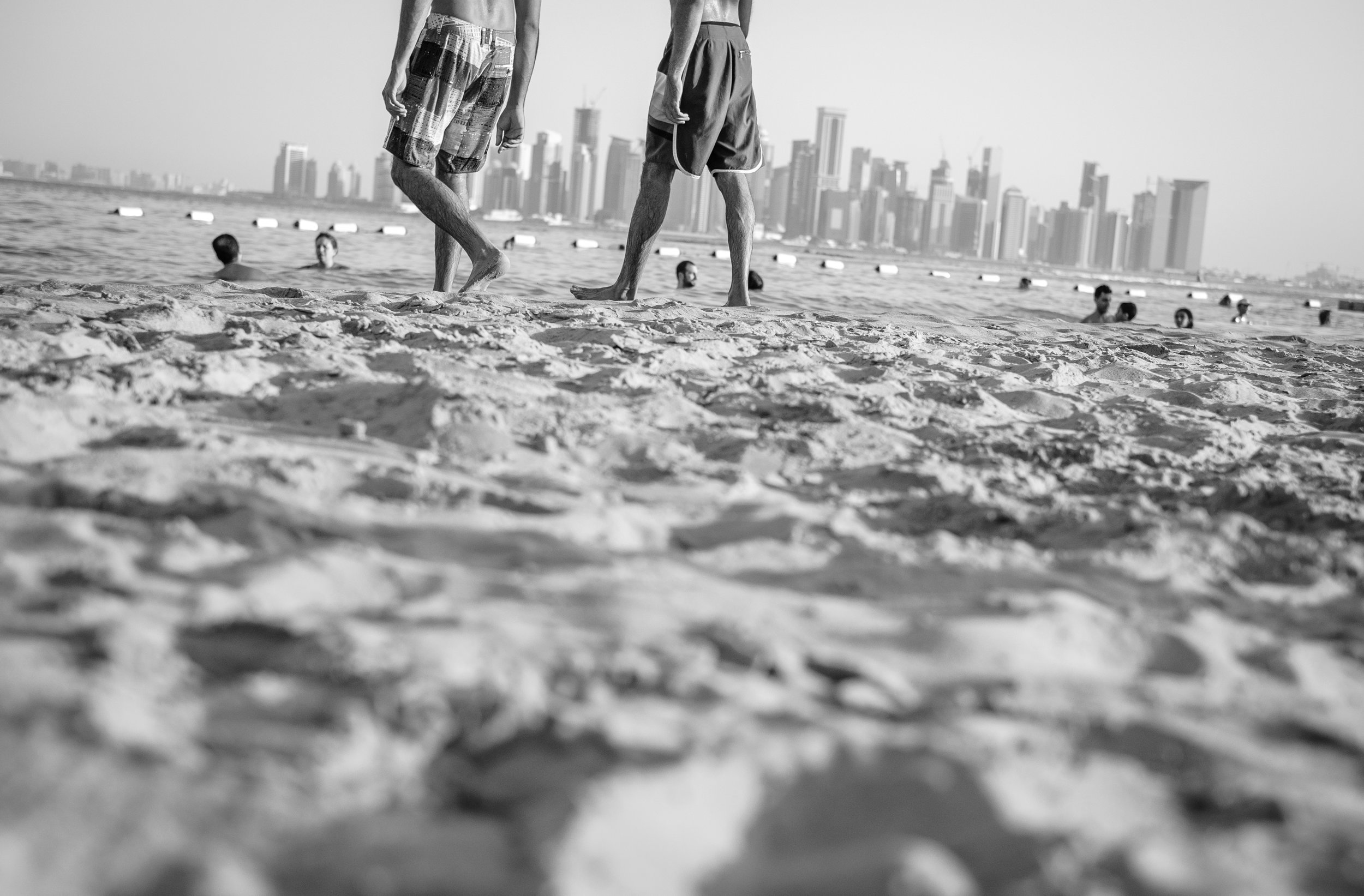  Expats enjoying the sun and sand at Nikki Beach on The Pearl in Doha. The Pearl is an artificial island comprising of luxury residential estates and businesses. It is the first land in Qatar made available for ownership by foreign nationals. The Wes