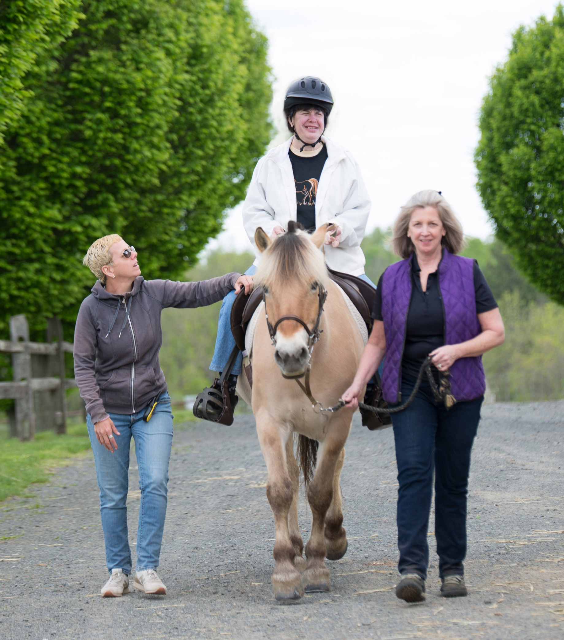 Jeanne Rogalin leading Norwegian Fjord Horse, Minnie during an Adaptive Riding Lesson. photography by: AbigailThomasNJ