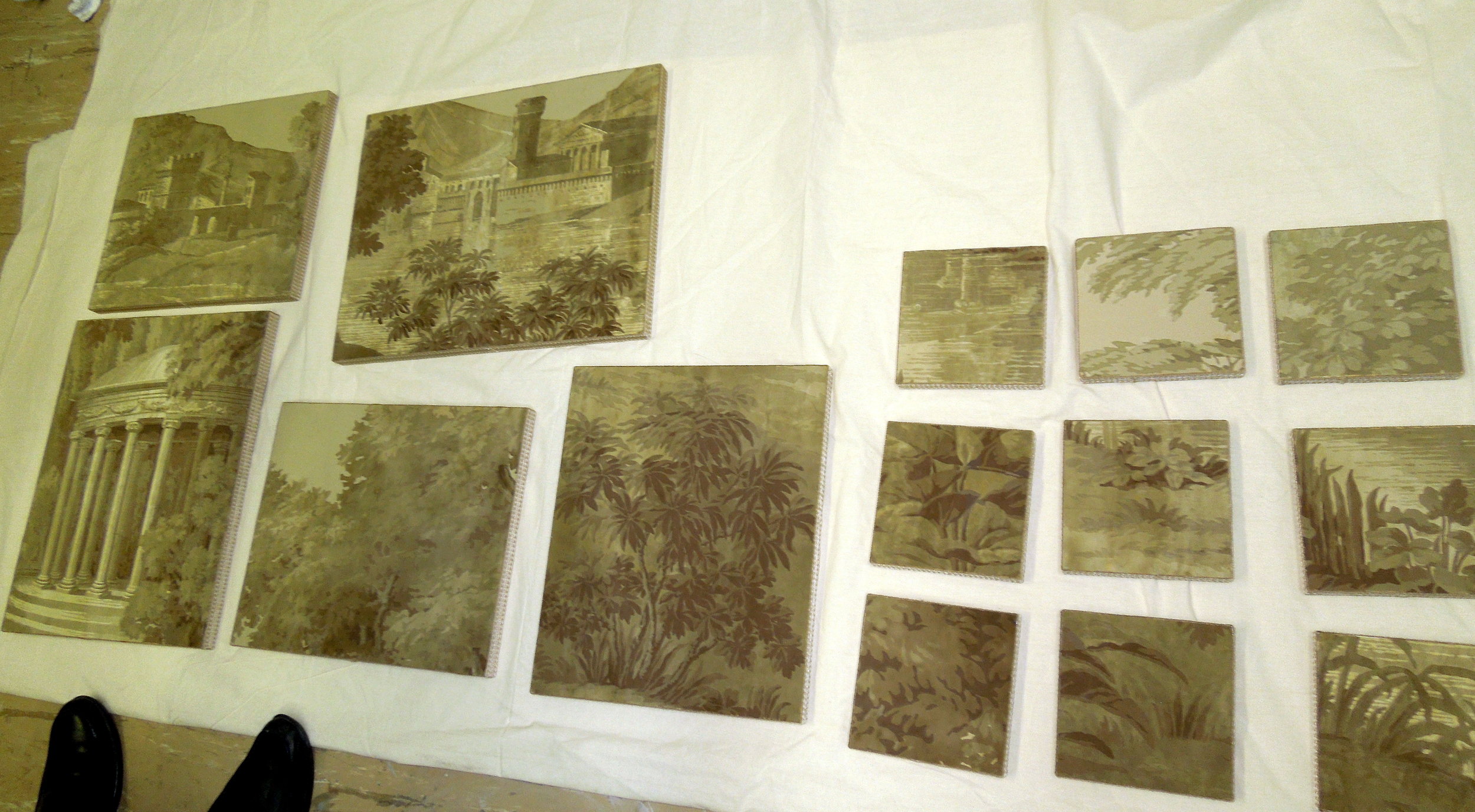 Rescued fragments of Paysage Italien after delamination and installation on boards