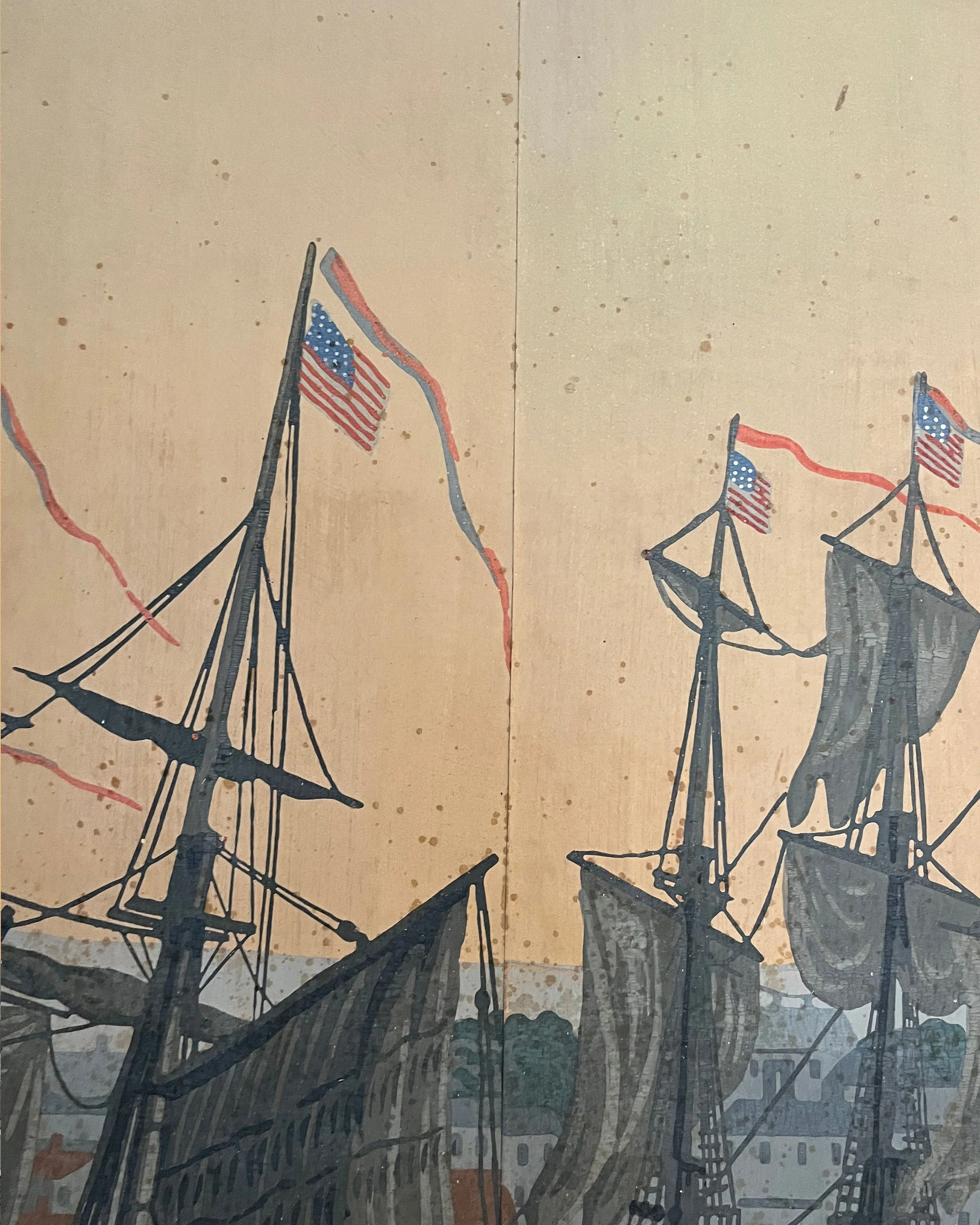 Close-up of age-related spotting on antique wallpaper before restoration