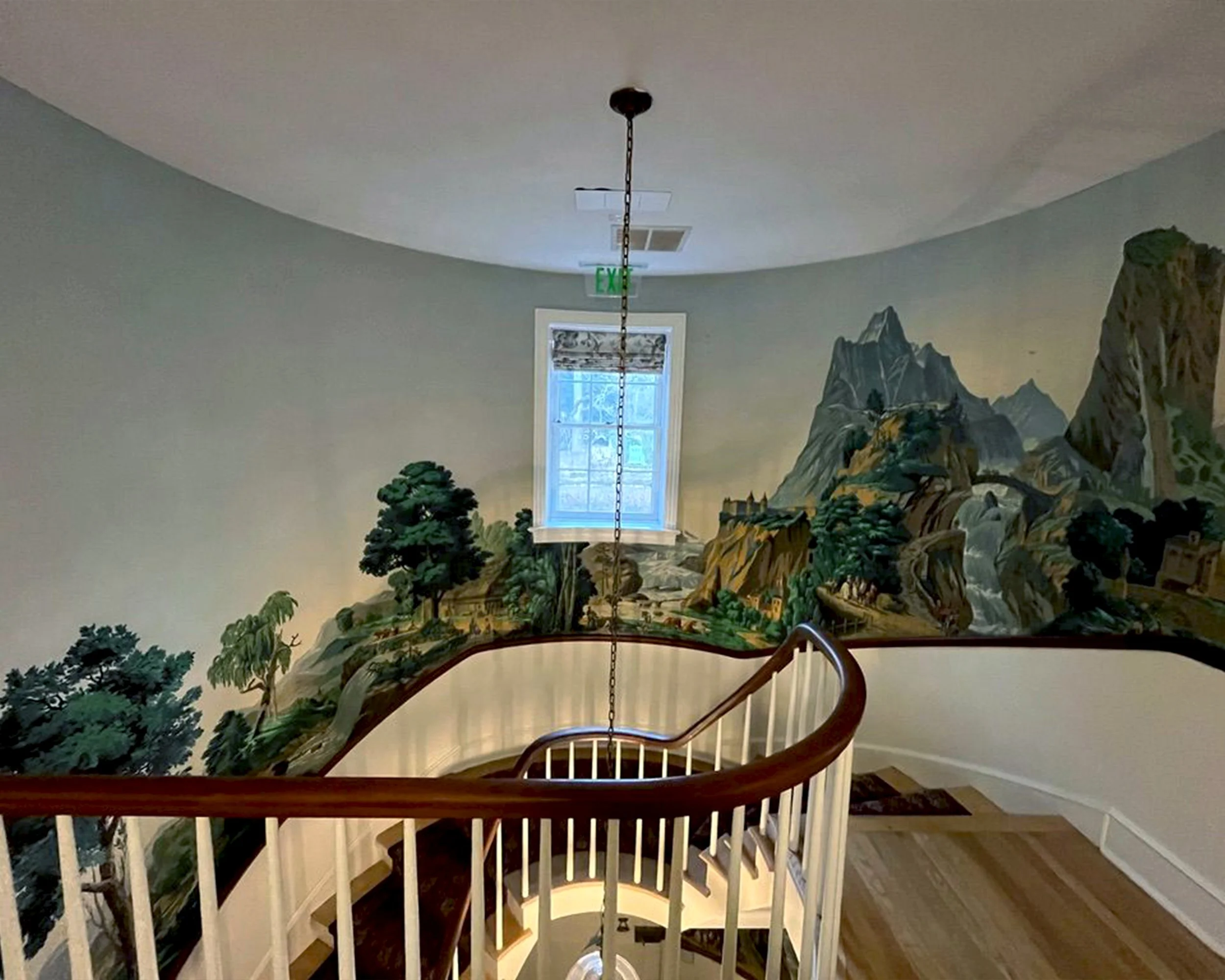 Zuber Les Vues de Suisse wallpaper installed along staircase at Greenwood Gardens after restoration
