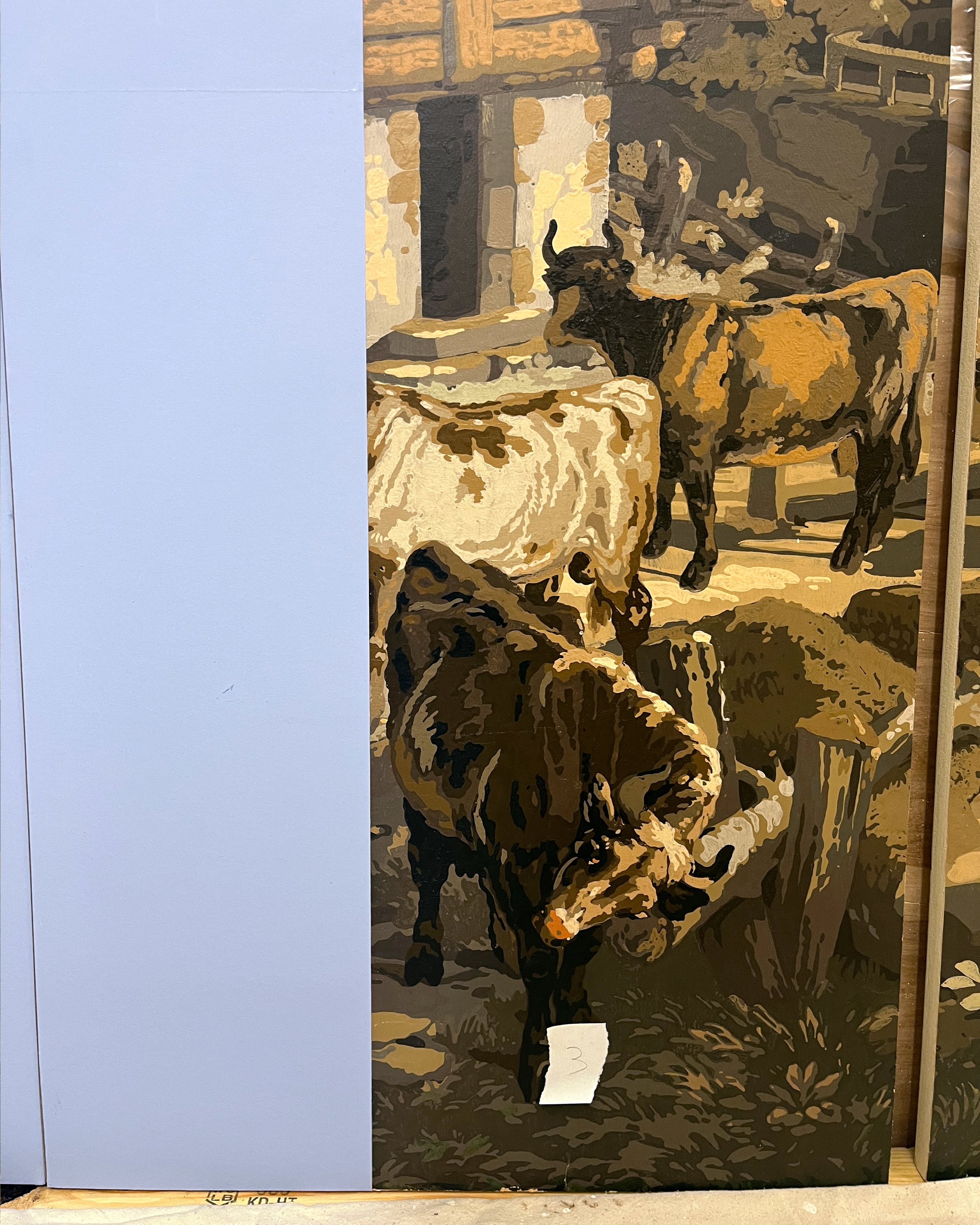 Before hand-painting restored sections of panoramic wallpaper to match original design