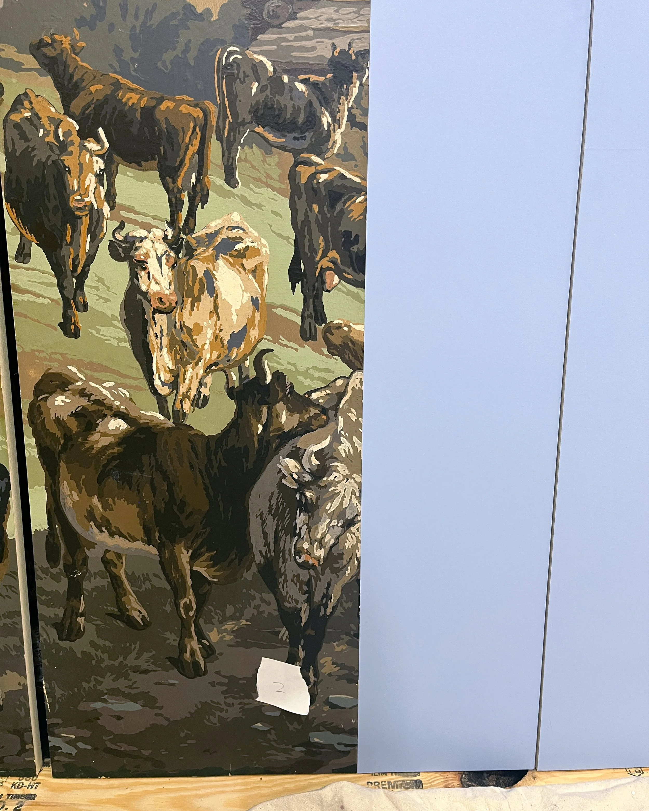 Hand-painting restored sections of panoramic wallpaper to match original design