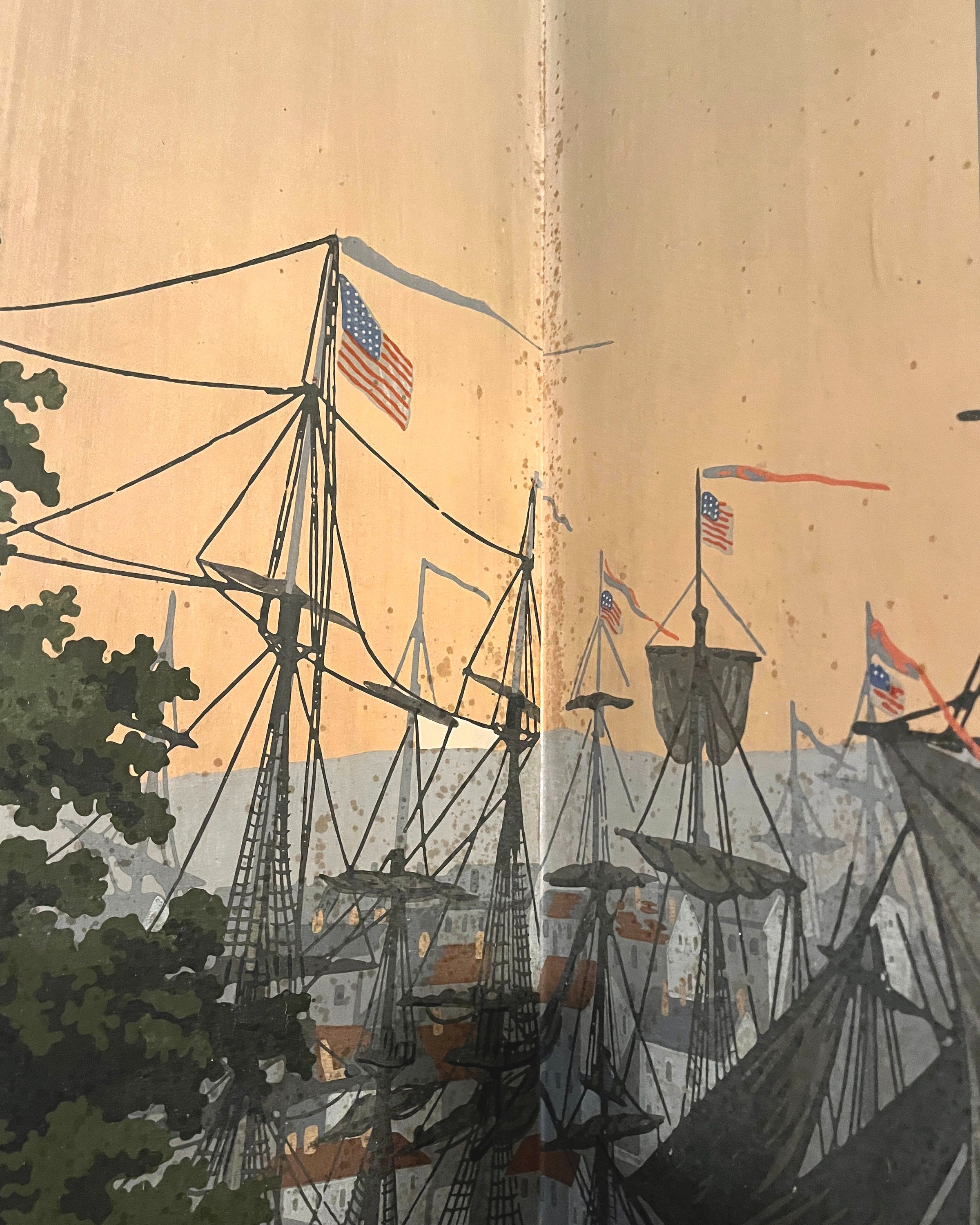 Close-up of age-related spotting on antique wallpaper before restoration